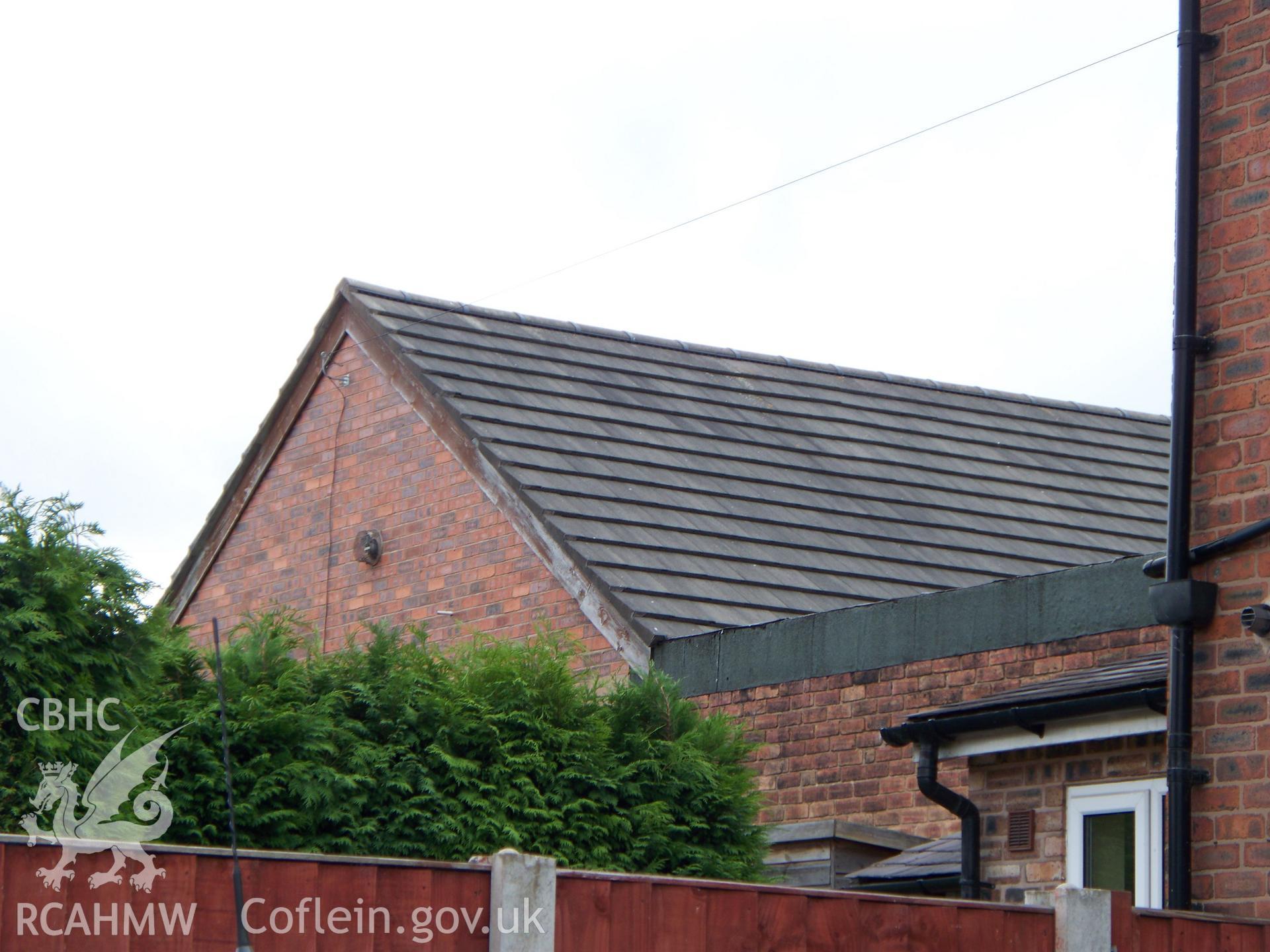 East rear side showing gabled rear block.