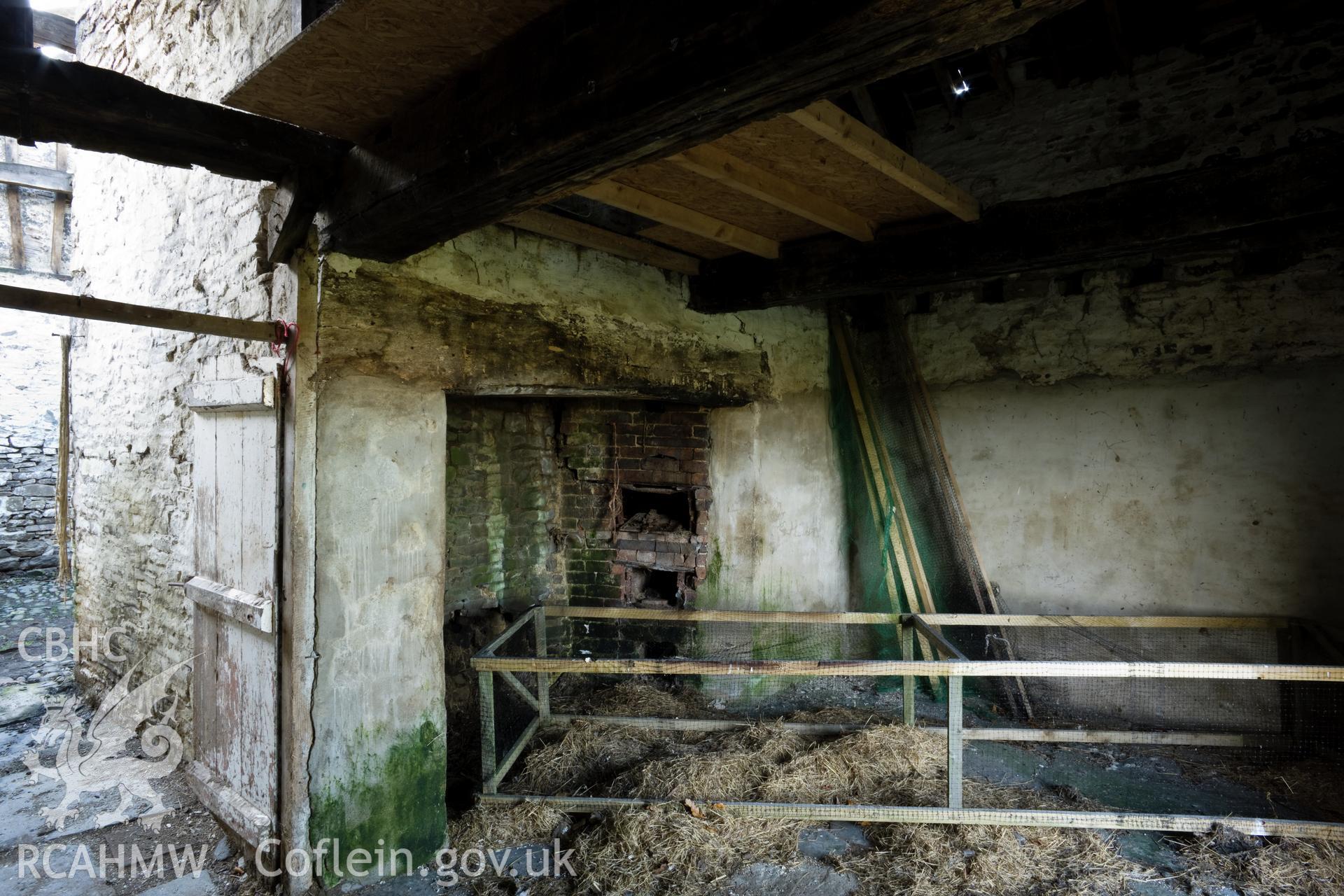 Kitchen fireplace with ovens.