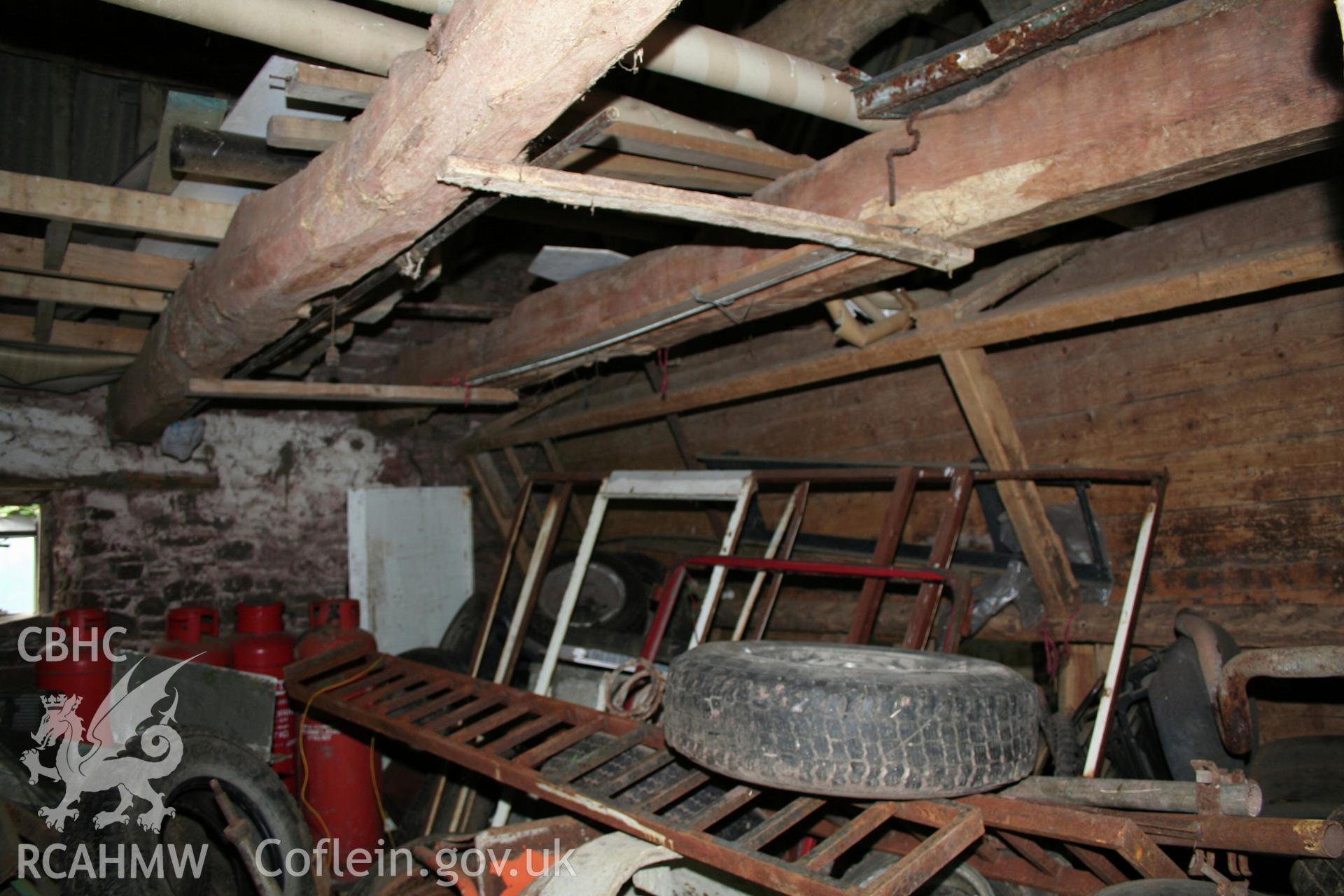Interior of stable, showing ceiling-beams.
