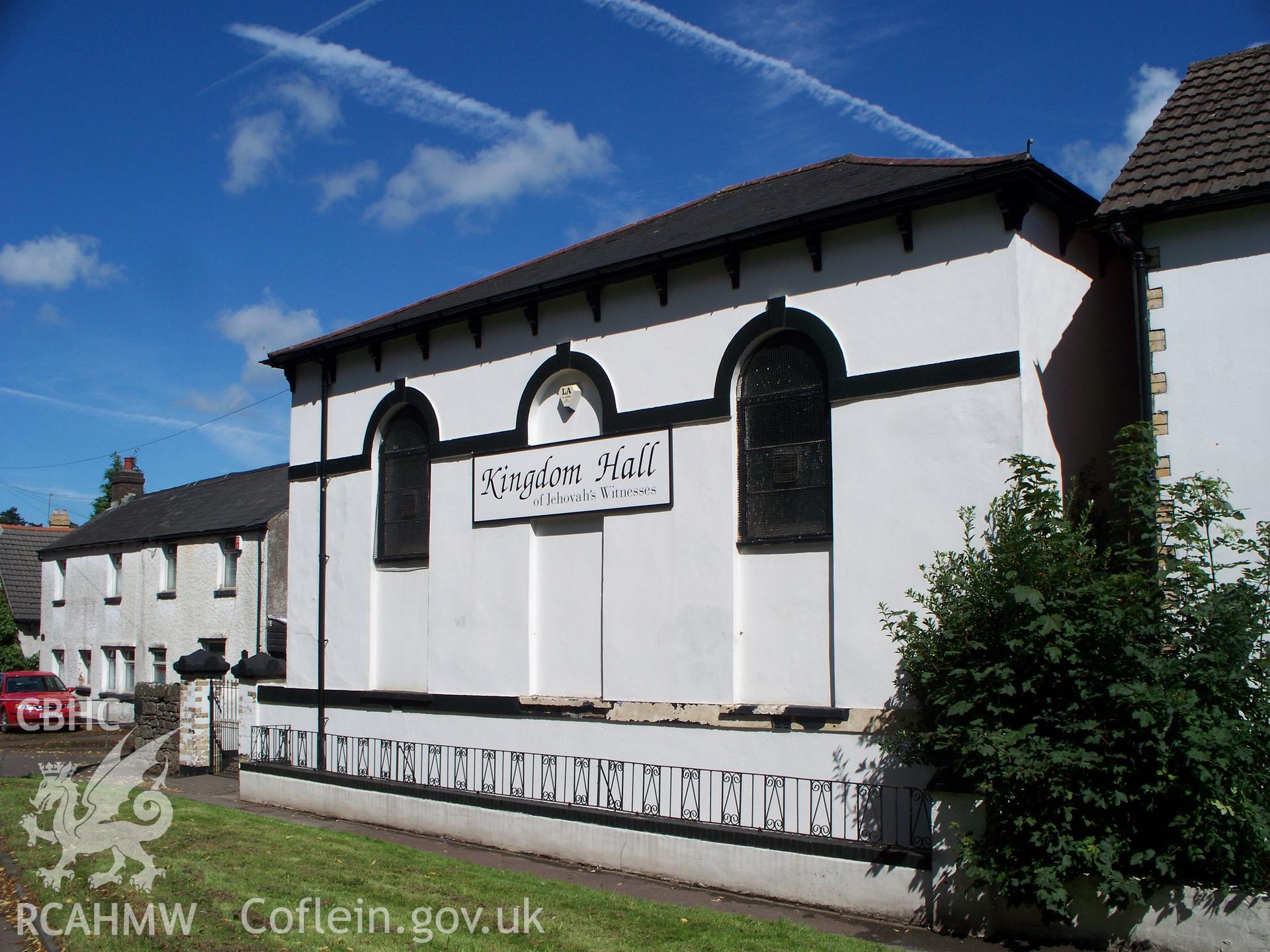 West wall of hipped-roof box chapel from SW.