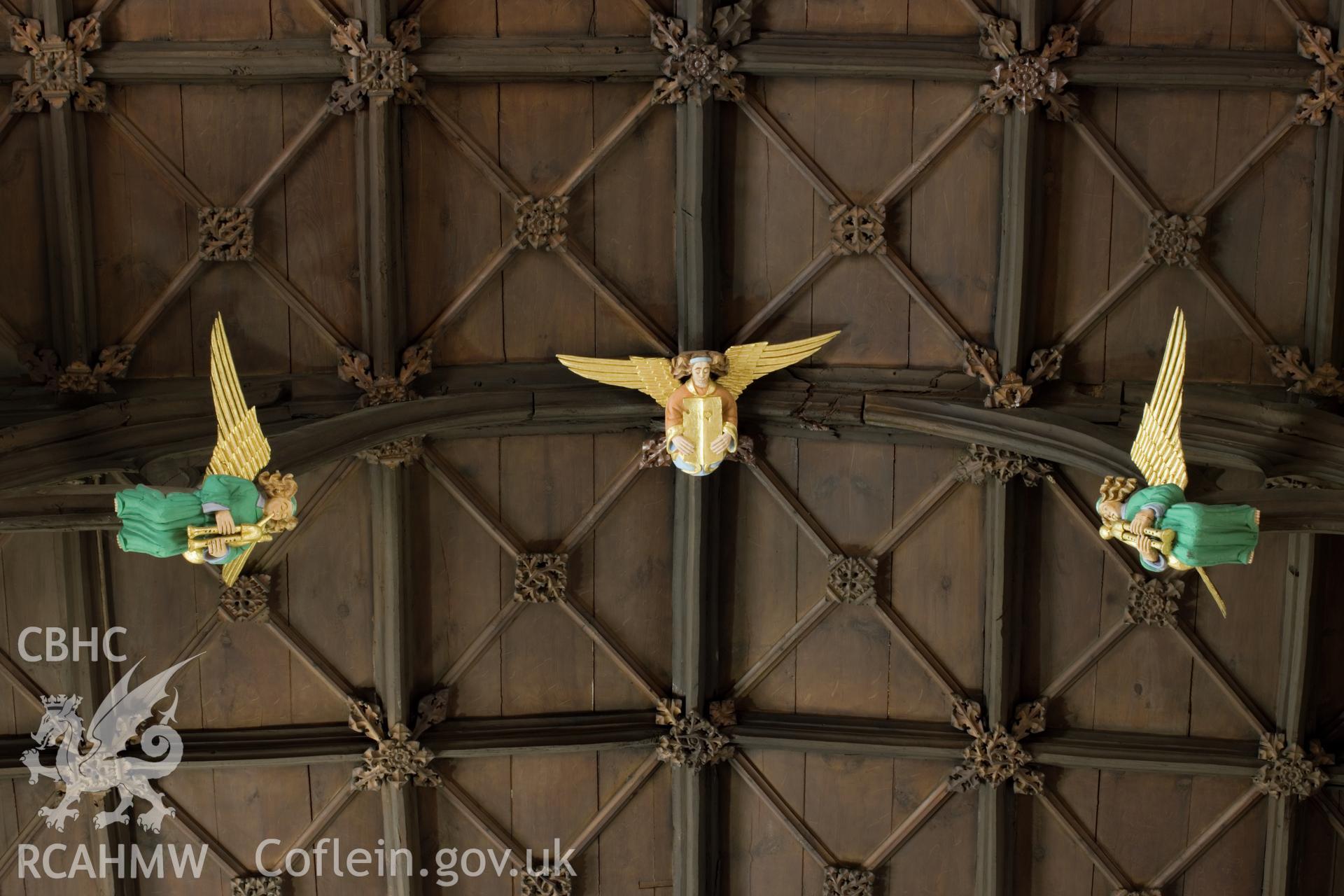 Carved angels on ceiling.
