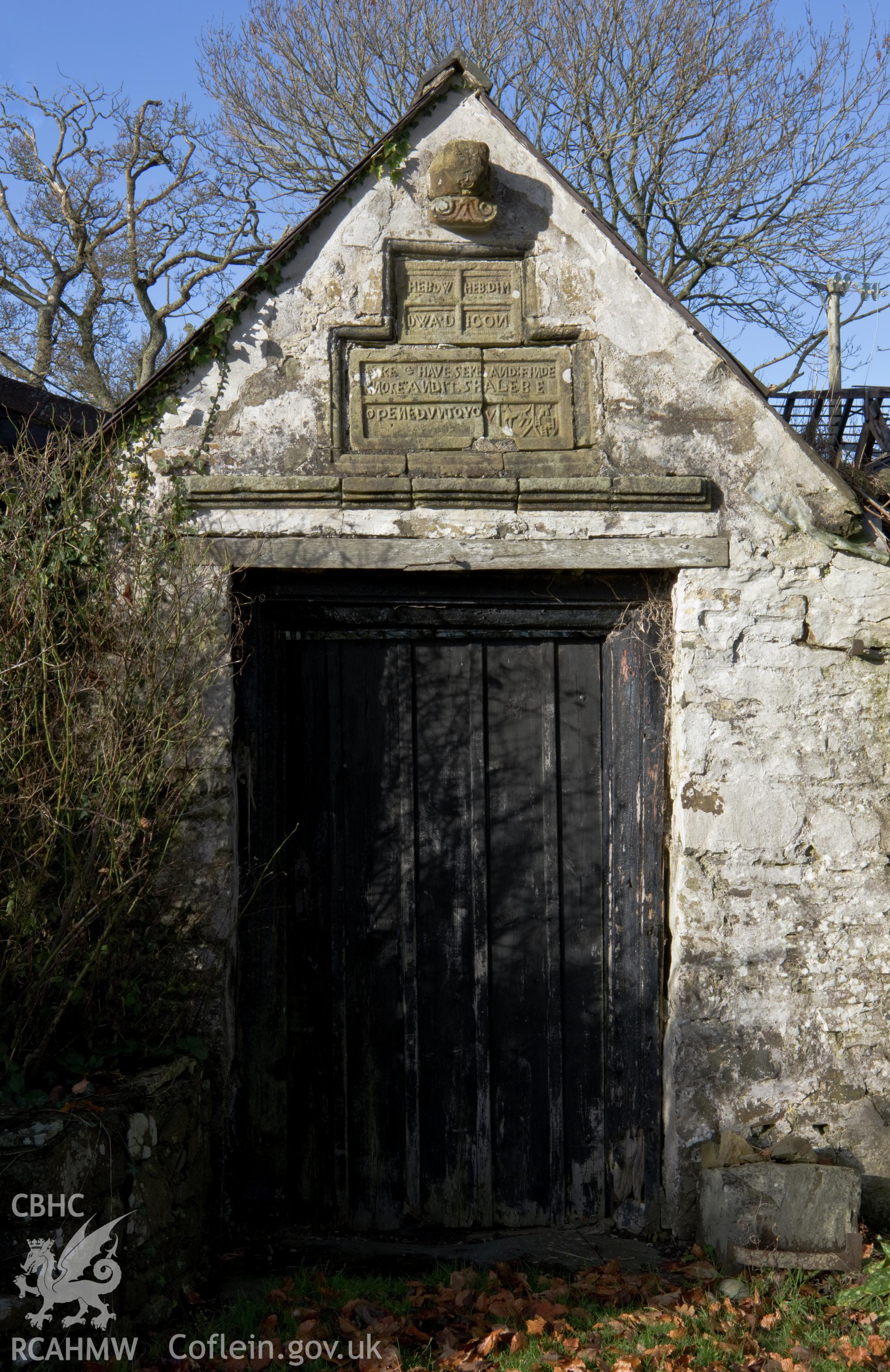 Doorway with overhead reset stone plaque.