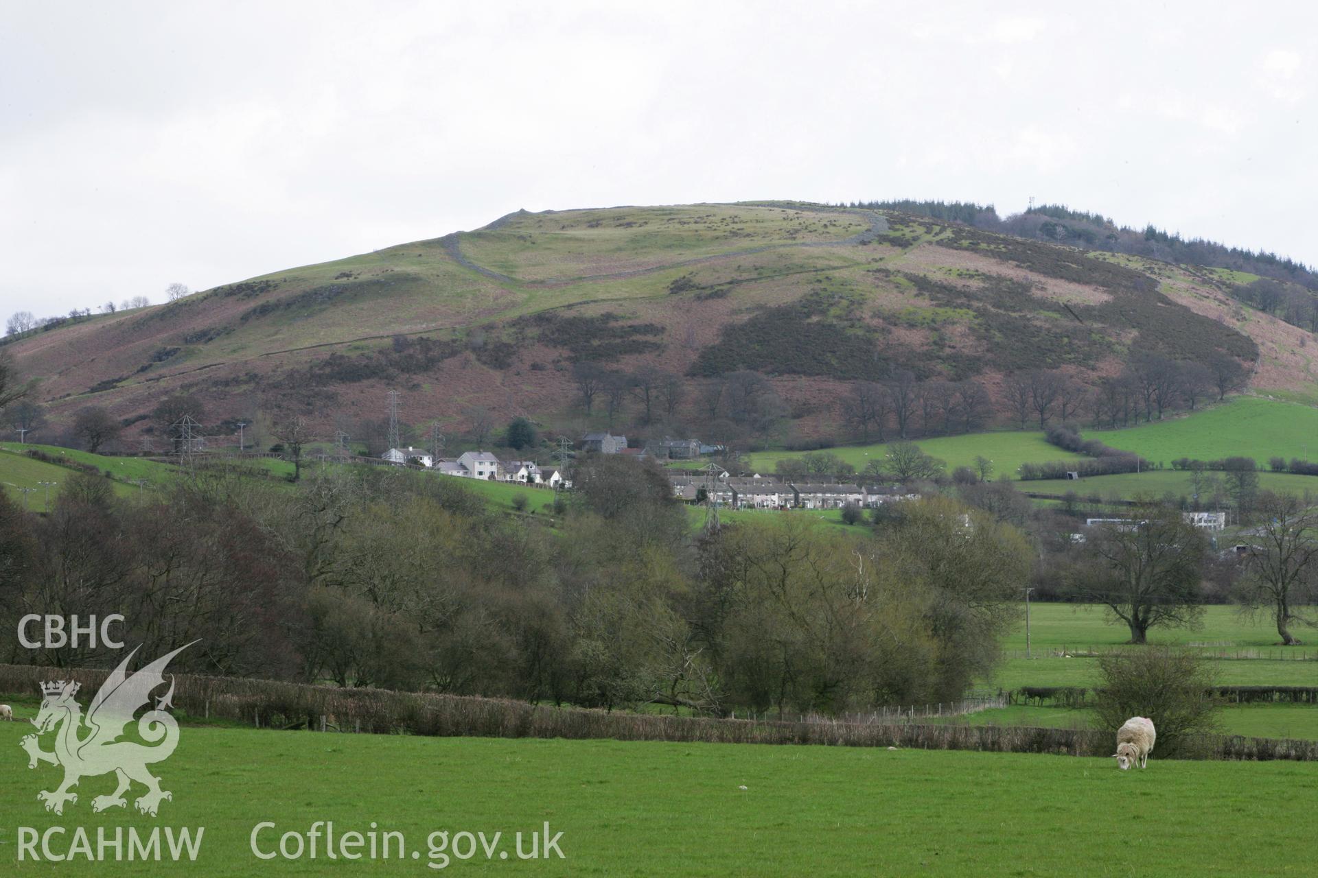 Caer Drewyn, view from west near Rug Chapel, showing rampart and visible hillfort interior