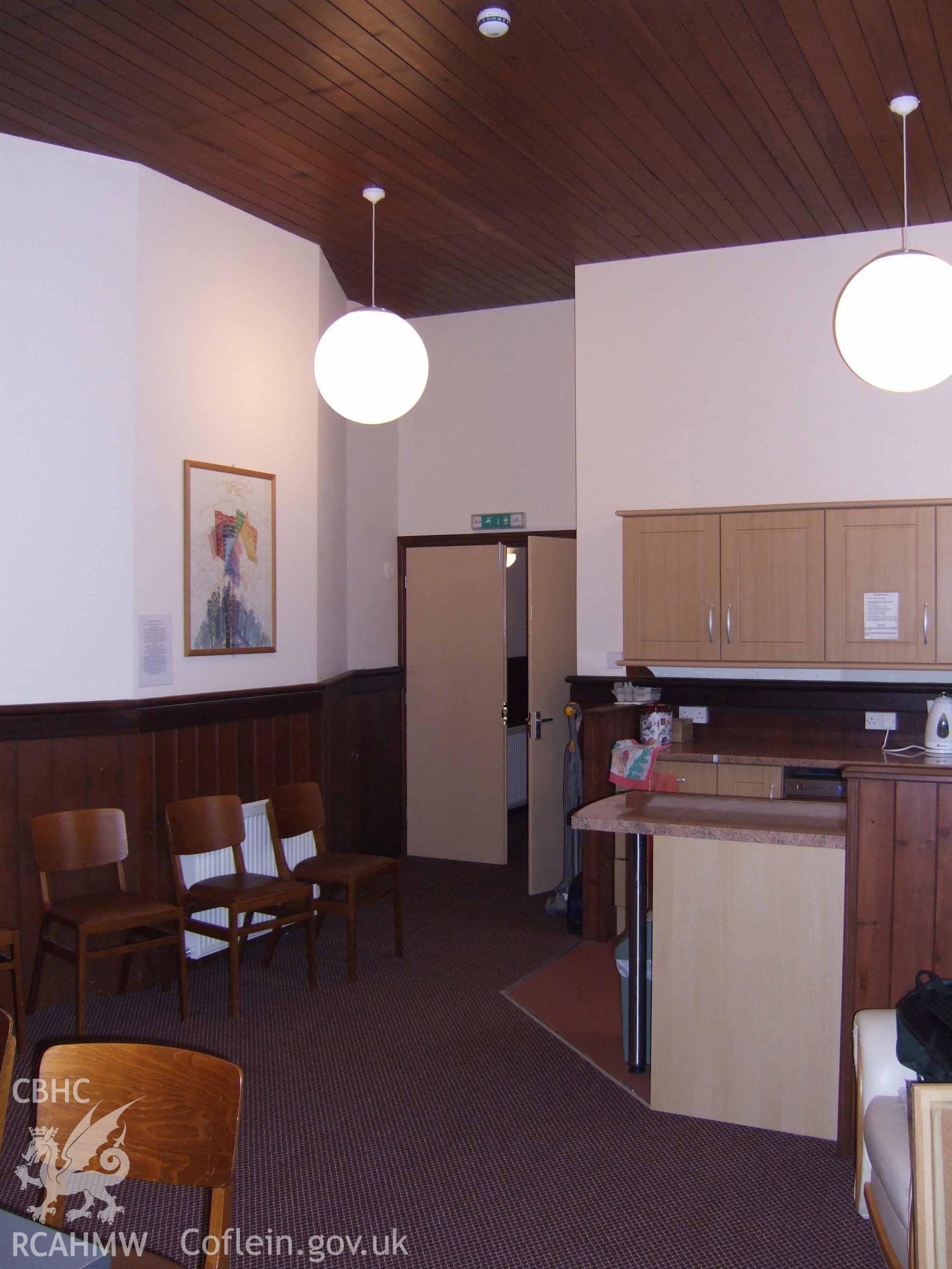 Vestry room behind pulpit at NE.