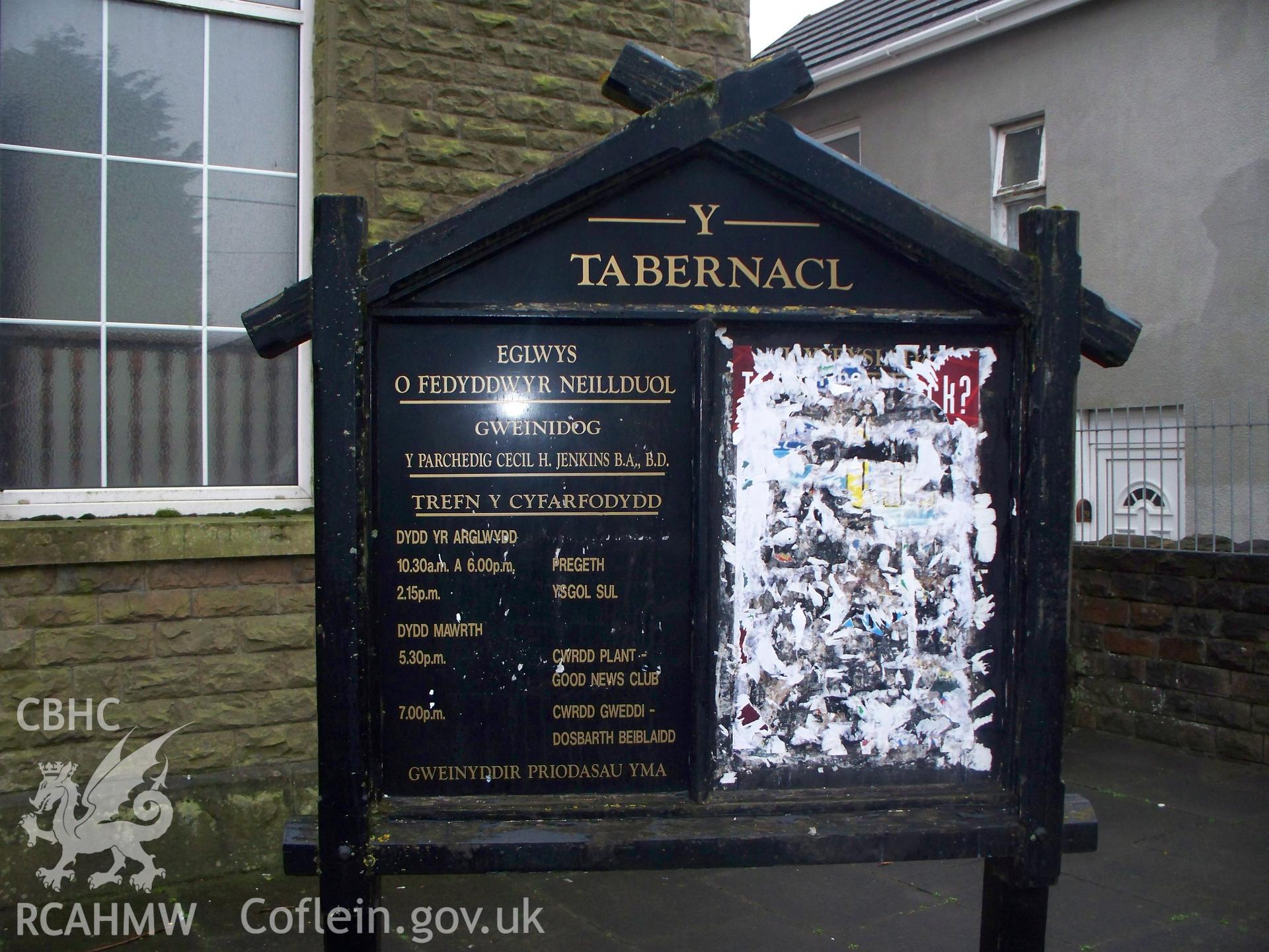 Noticeboard on NE front.