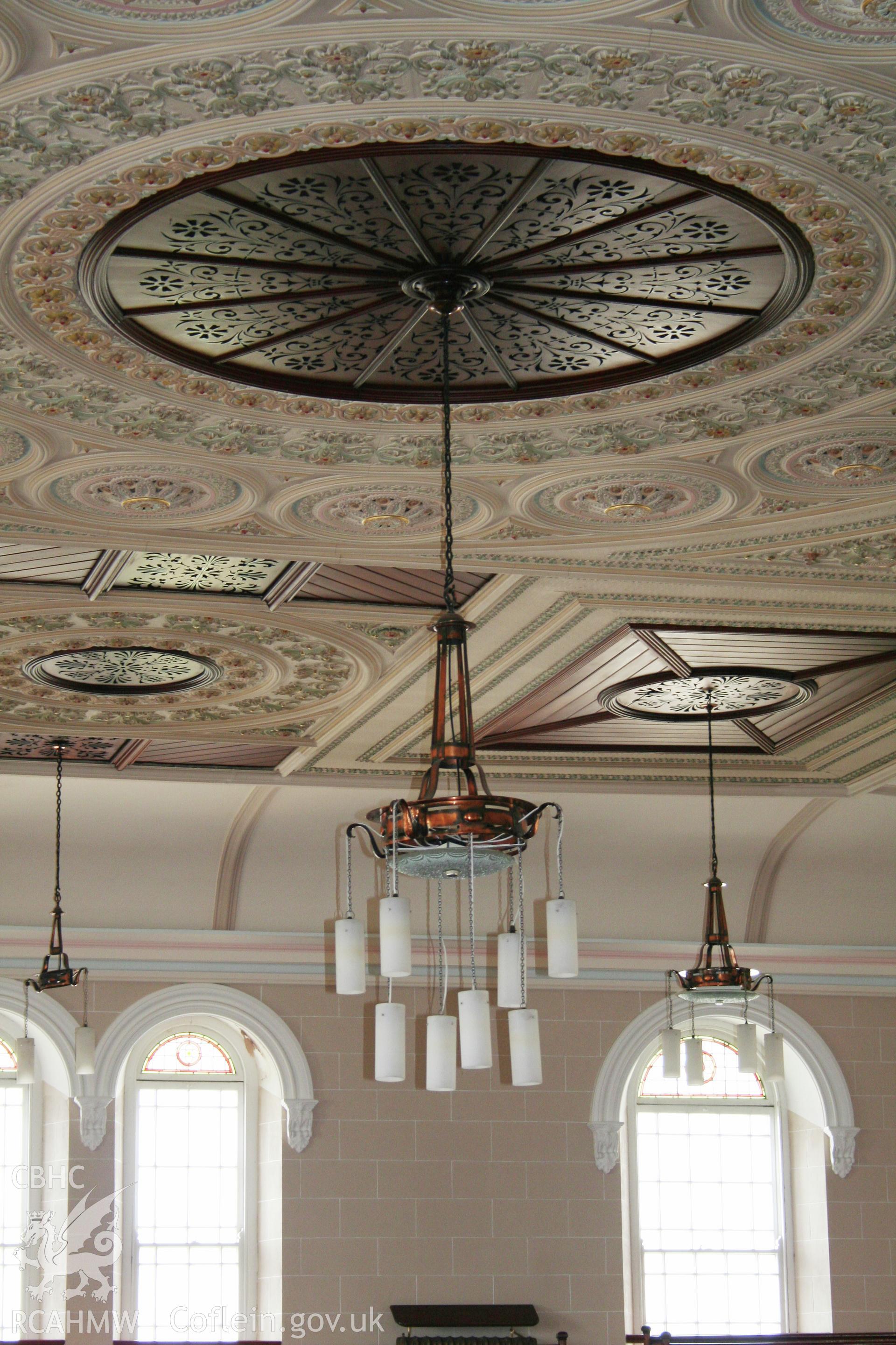 Capel Als, light hanging from the central panel of the main interior ceiling.