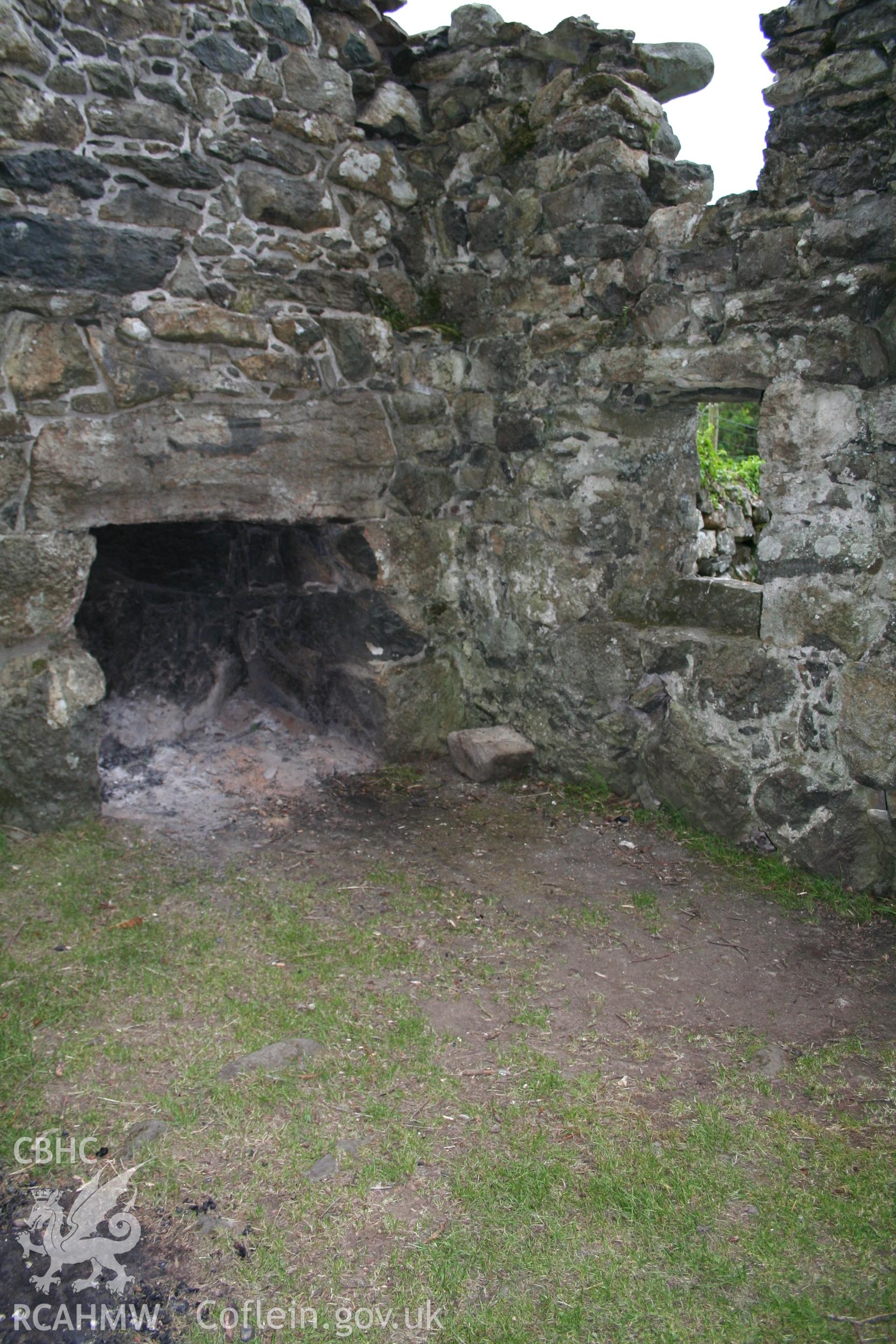 Interior of cottage looking towards the fireplace.