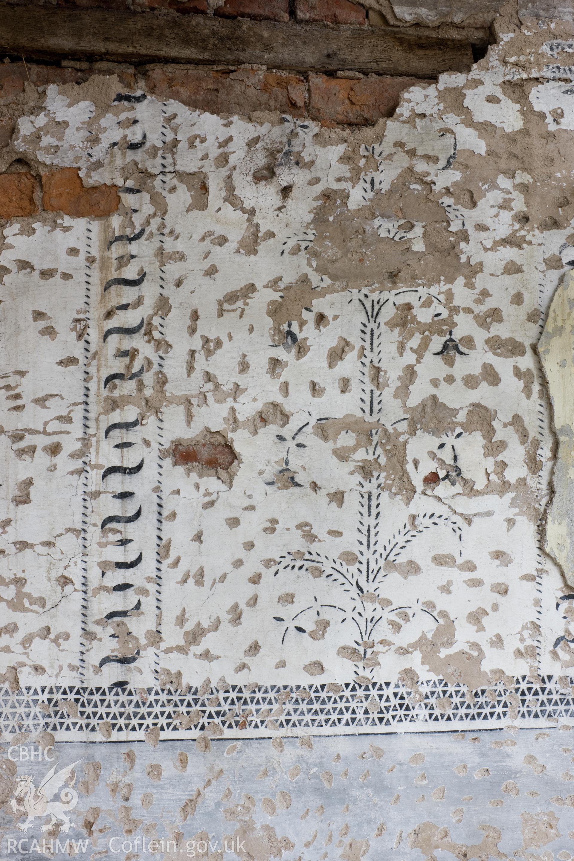 Detail of decoration on north wall of central bay, first floor.