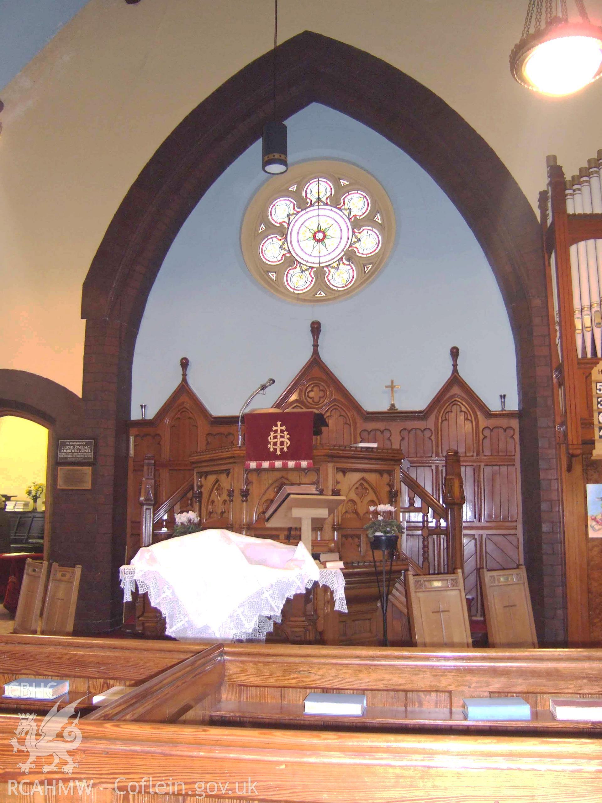Pulpit & reredos at NE end.