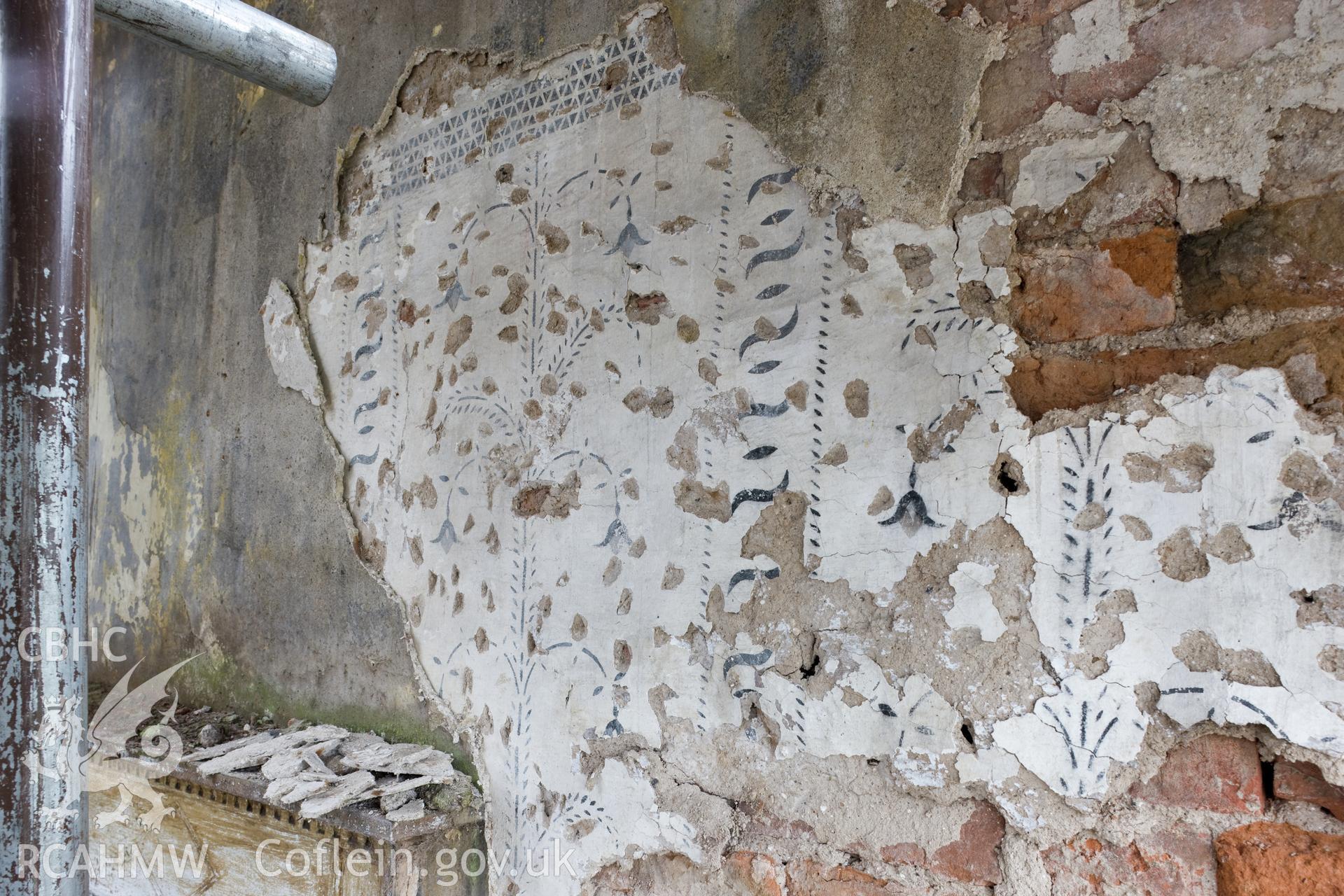 Detail of decoration on north wall, first floor, central bay.