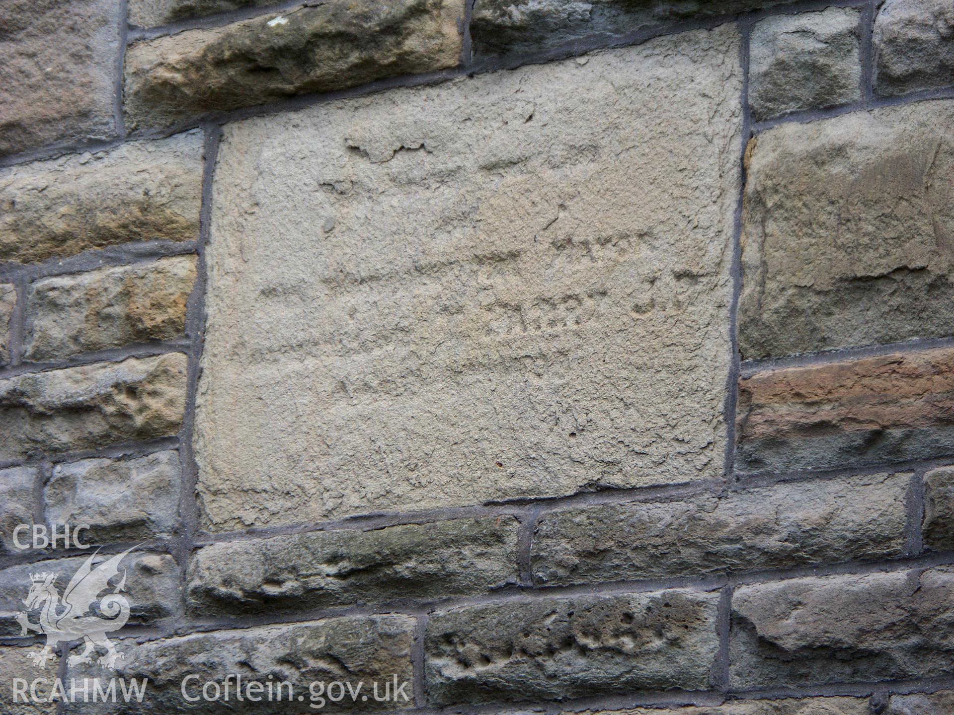 Second north foundation-stone on NW front.