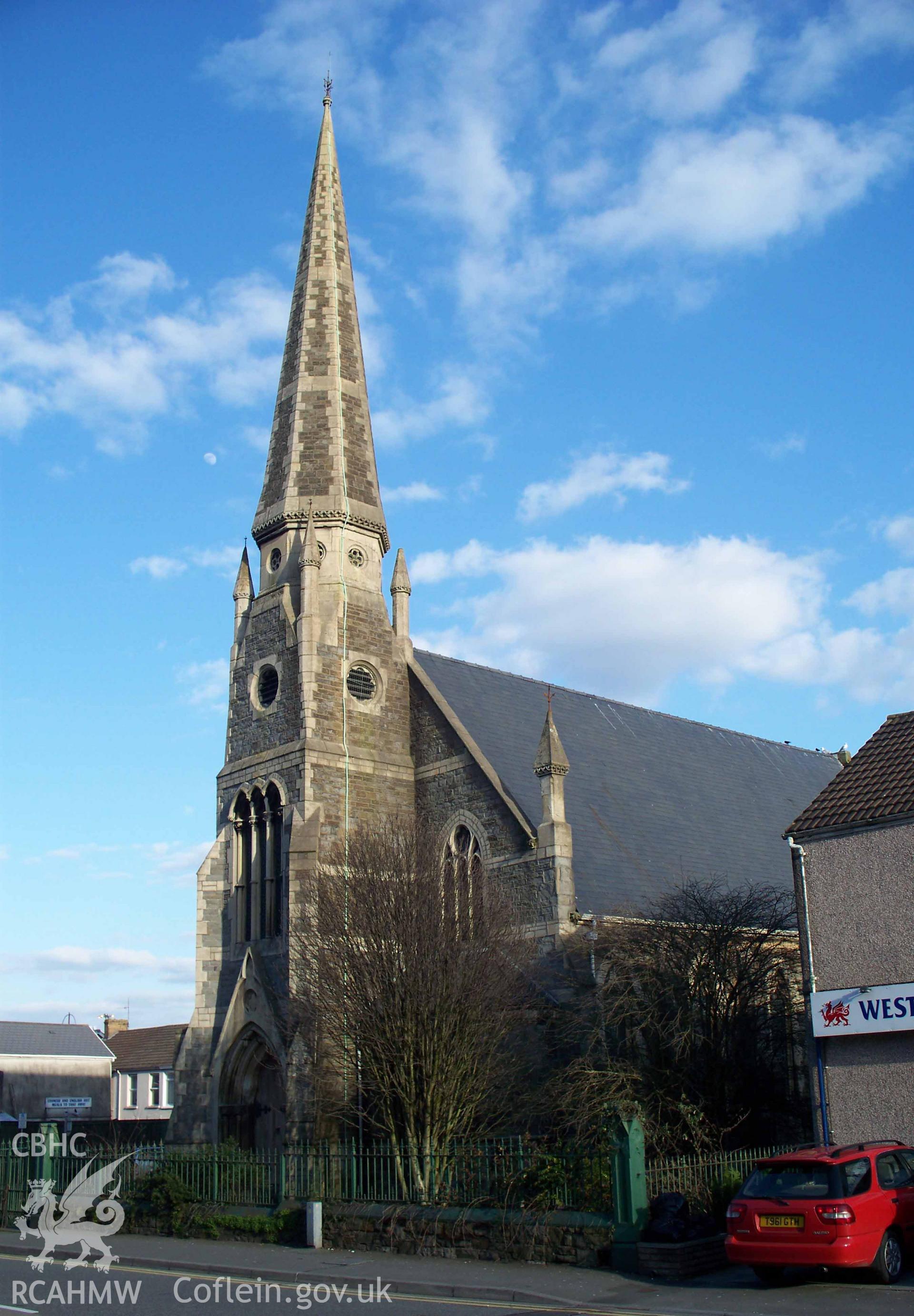 Main NW entrance with tower & spire & SW side.