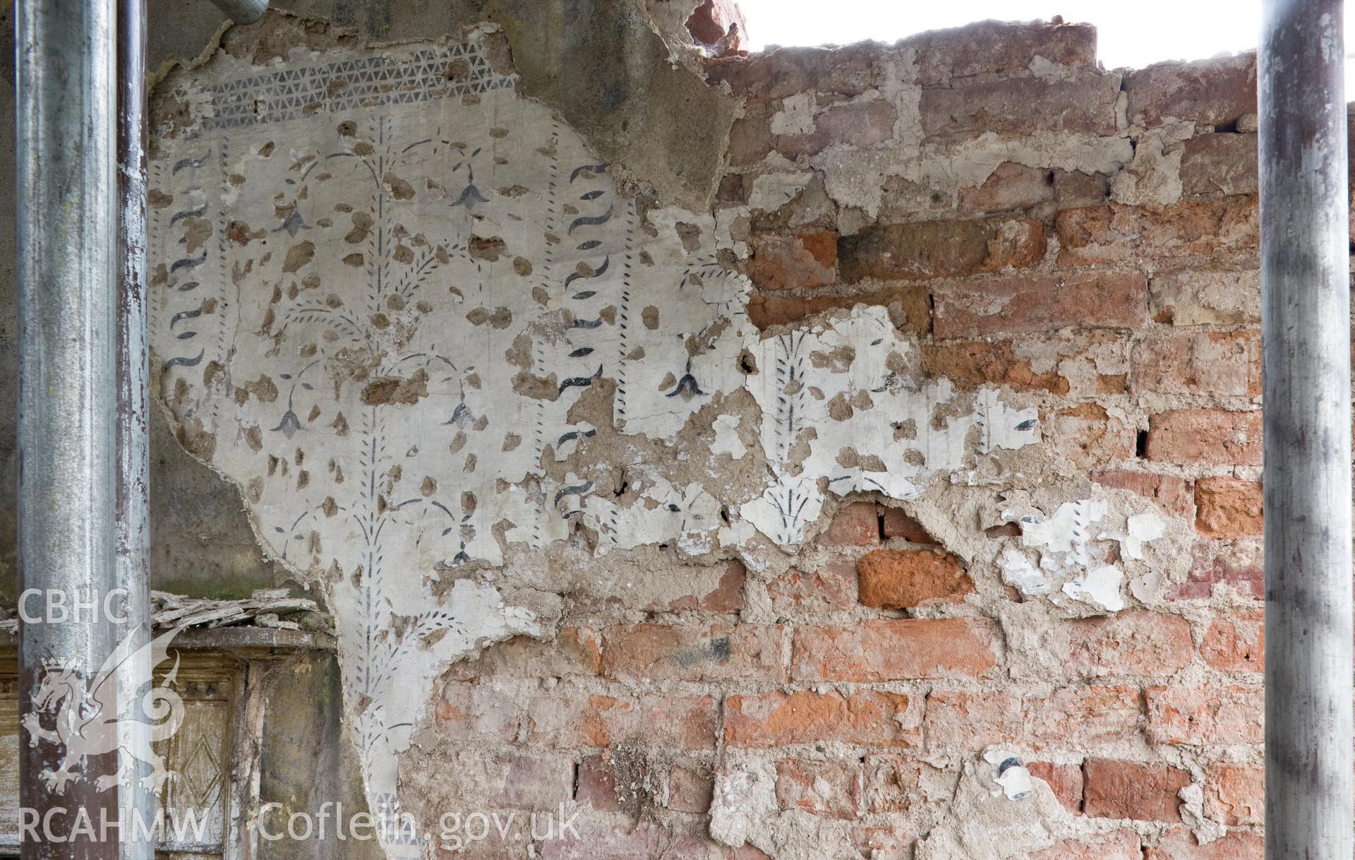 Detail of decoration on north wall, first floor, central bay.