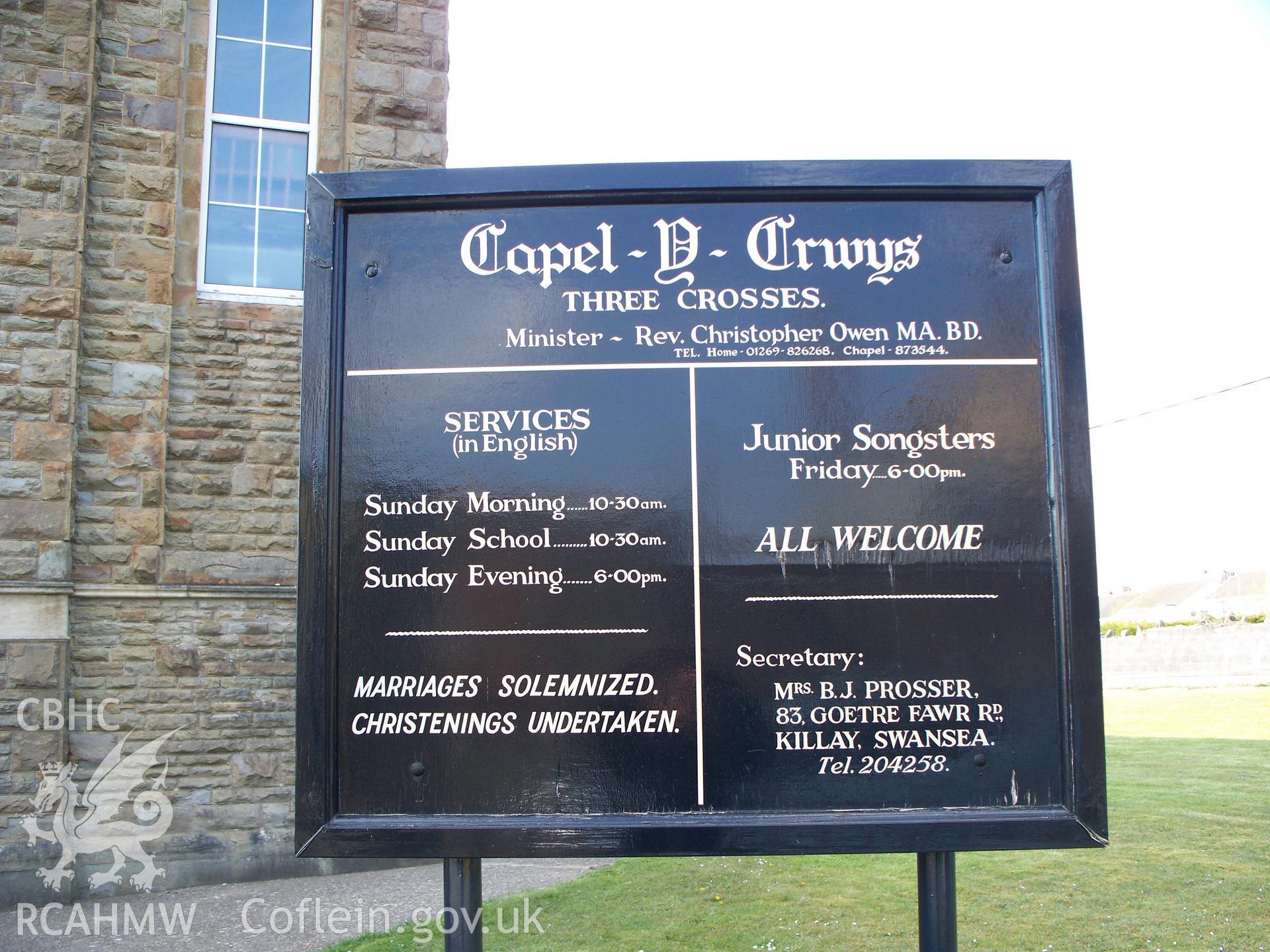 Chapel order of services board outside SE gable.