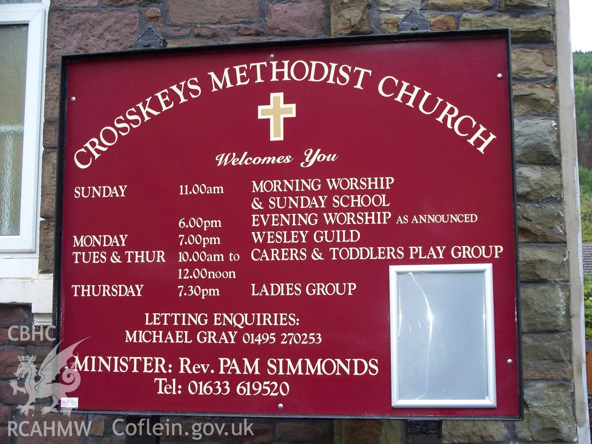 Order of service board outside NE front.