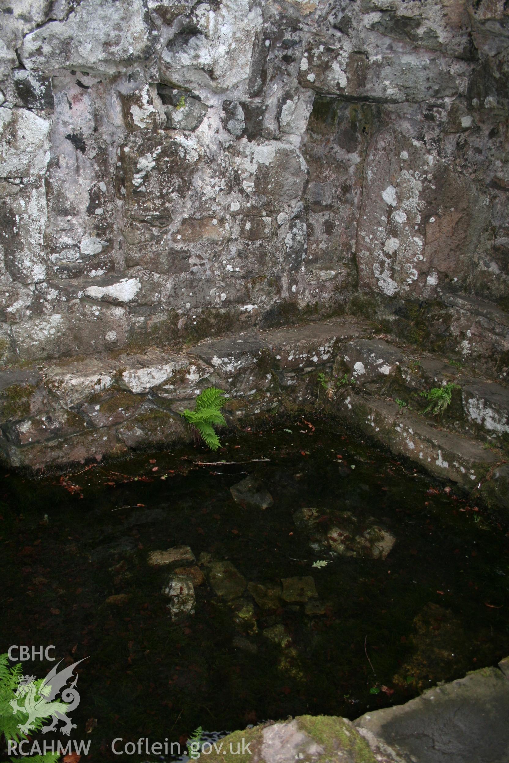 Interior of well chamber with sunken tank.