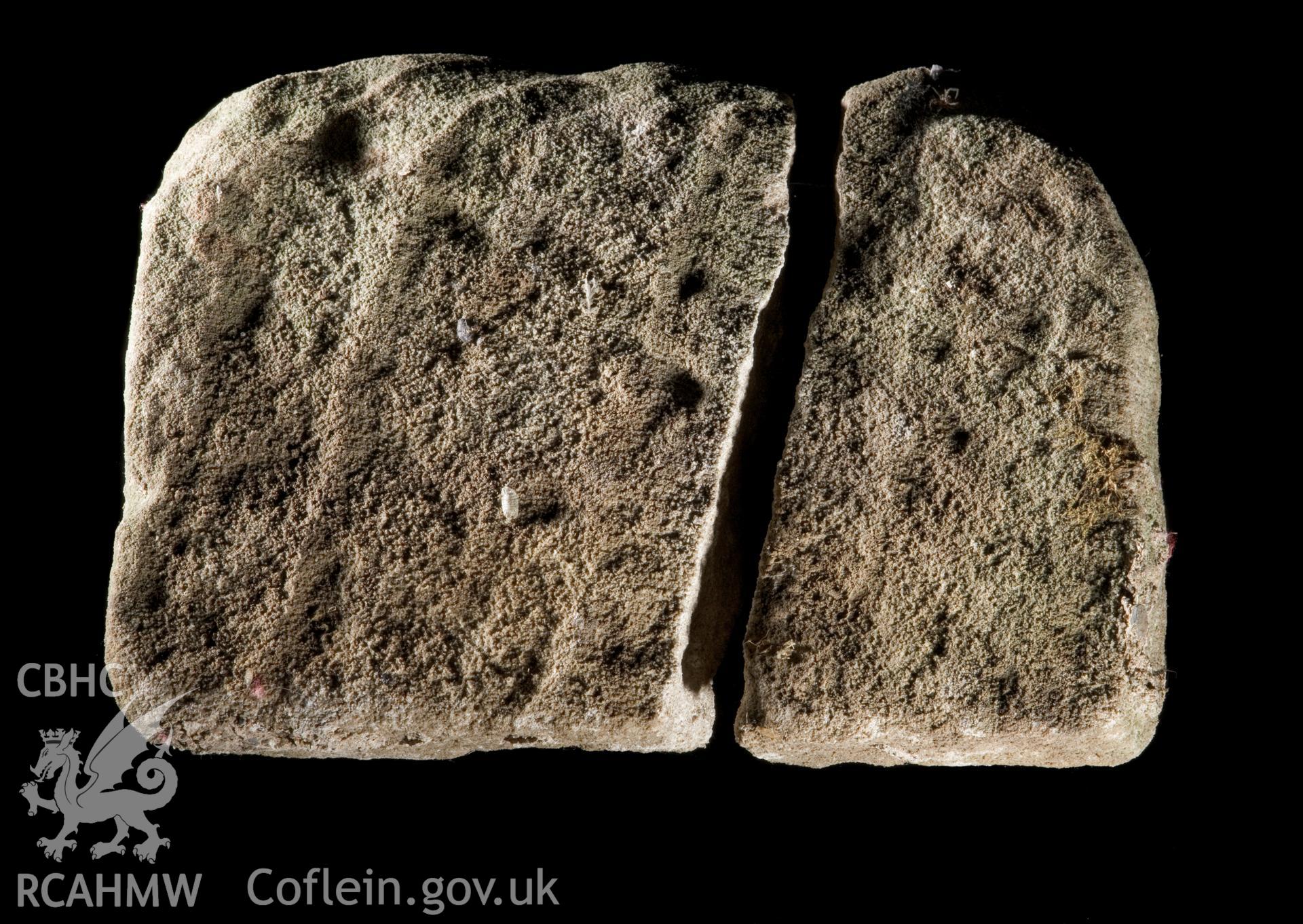Carved stone found during repairs to wall, rear view.