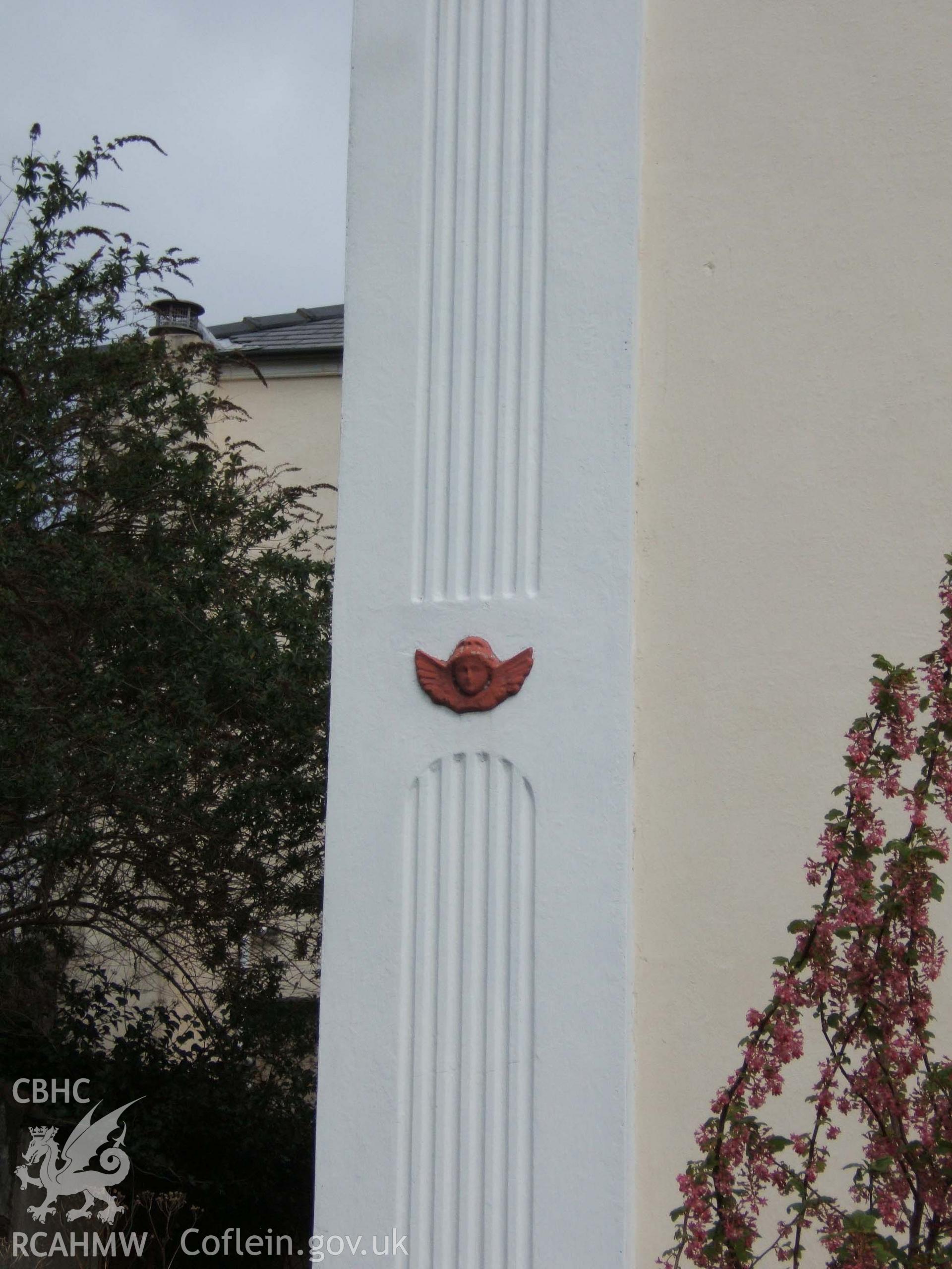 Cherub ornament on south-west pilaster.