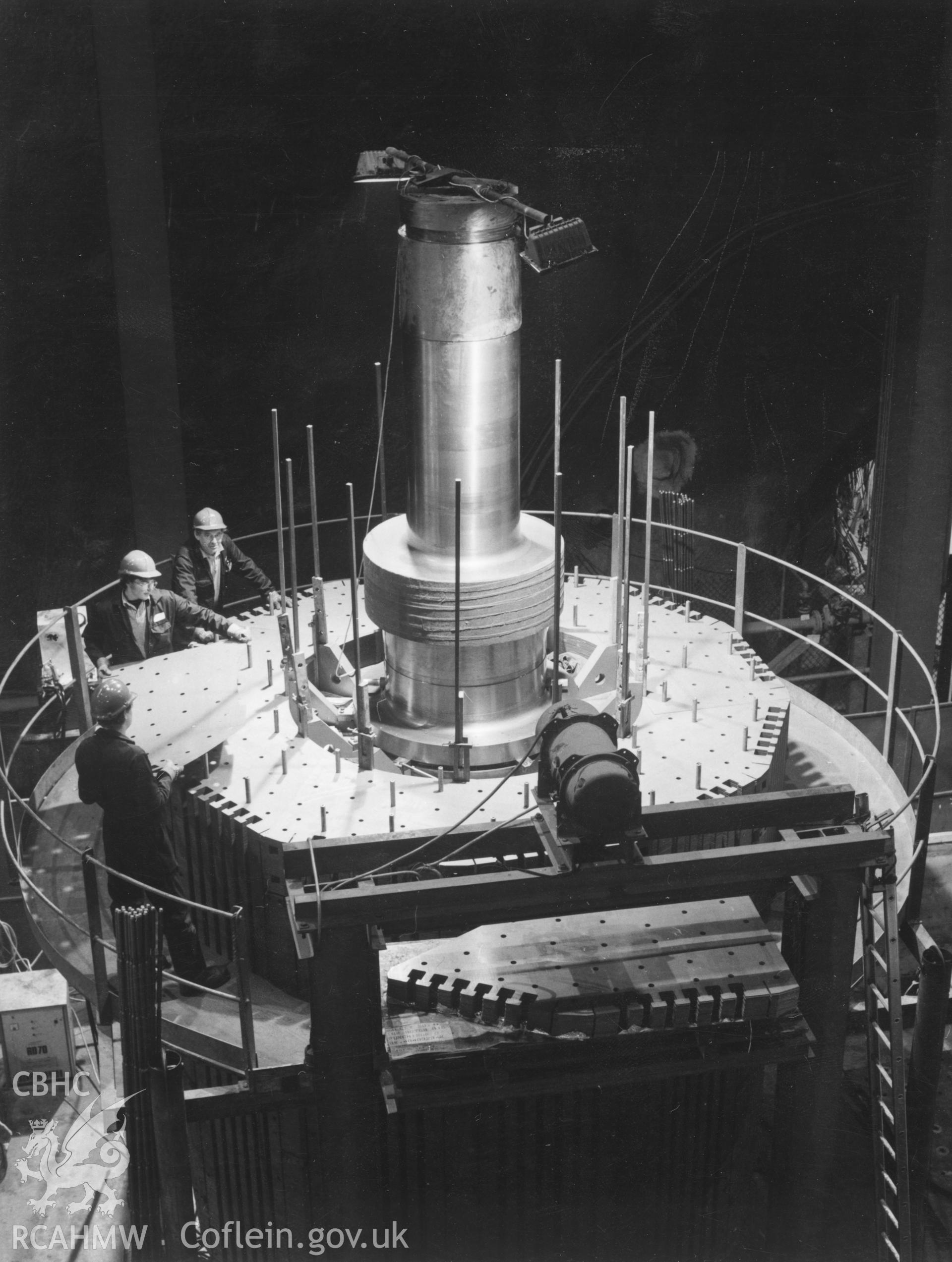 1 b/w print showing assembly work on one of the reversisible generator motors at Dinorwig Power Station; collated by the former Central Office of Information.