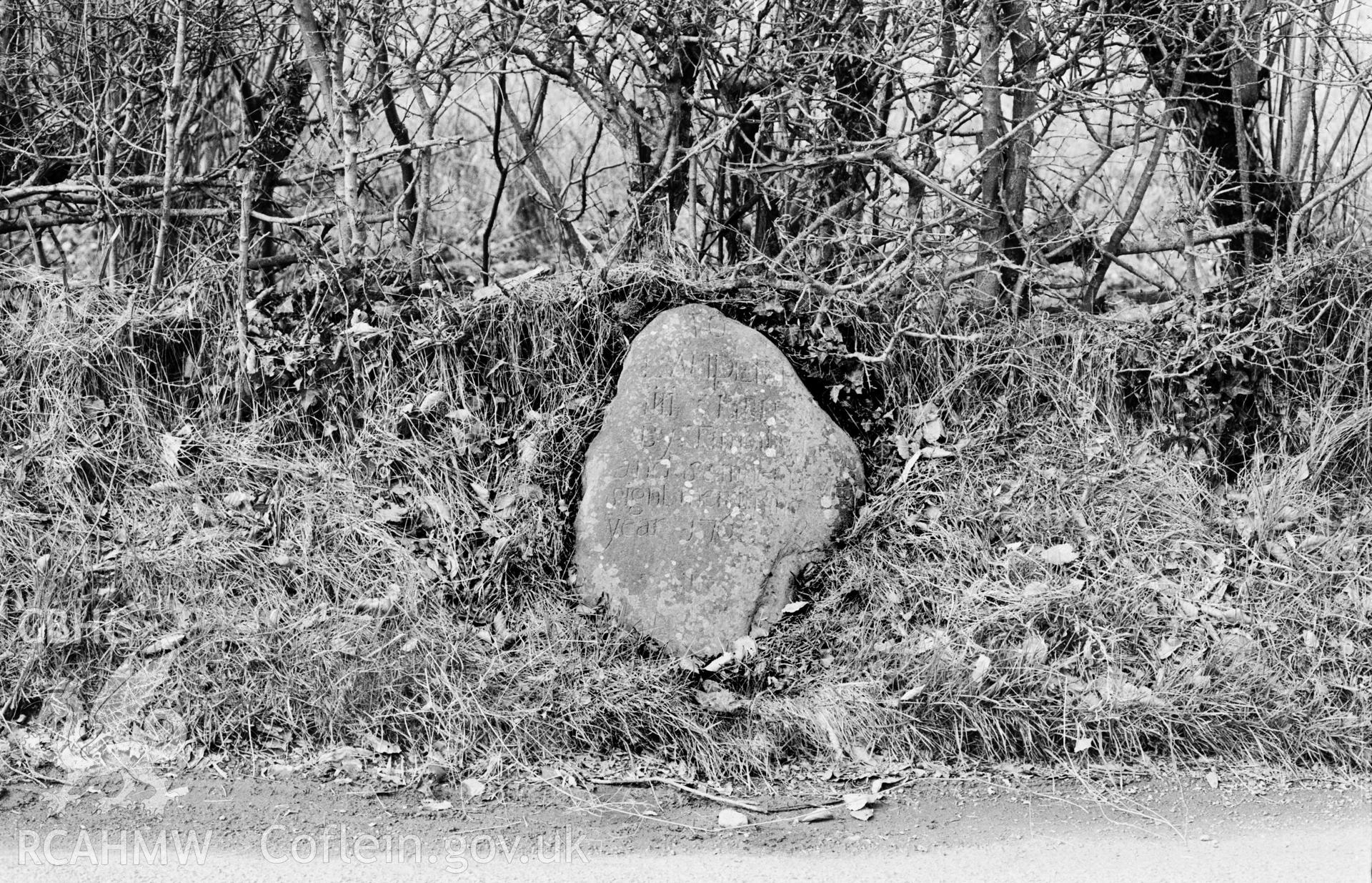 Black and white photograph of a milestone south-west of Llangybi produced by Arthur Chater in 1966, part of a larger collection which has not yet been fully catalogued.