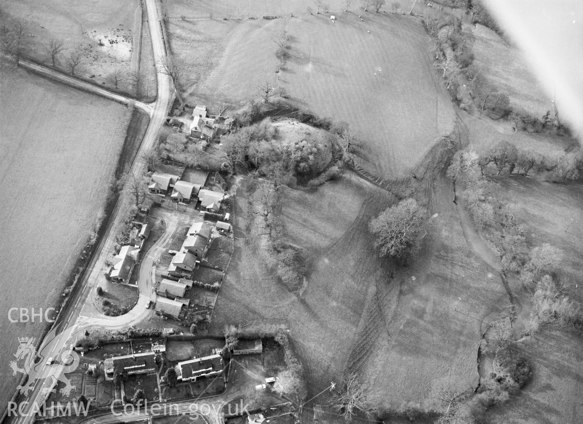 RCAHMW black and white aerial photograph of Llanfechan Motte and Bailey. Taken by C R Musson on 30/01/1995