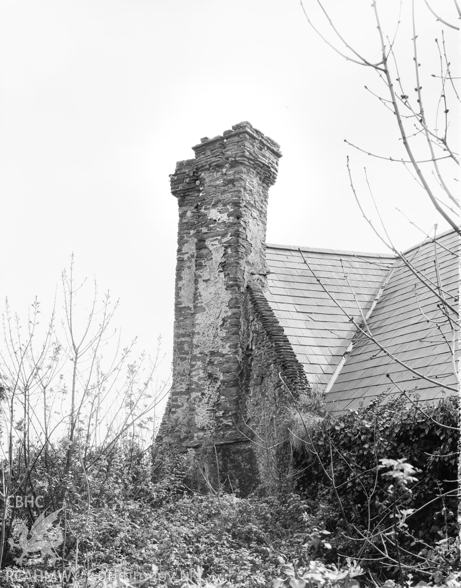 Exterior view, showing twin chimney stacks on east gable of south block