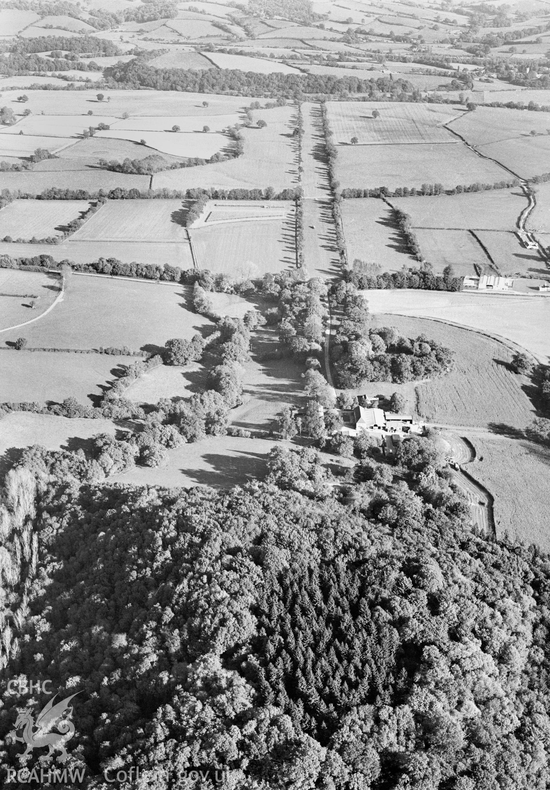 RCAHMW Black and white oblique aerial photograph of Tregrug Castle, Llangybi , taken on 18/10/1999 by Toby Driver