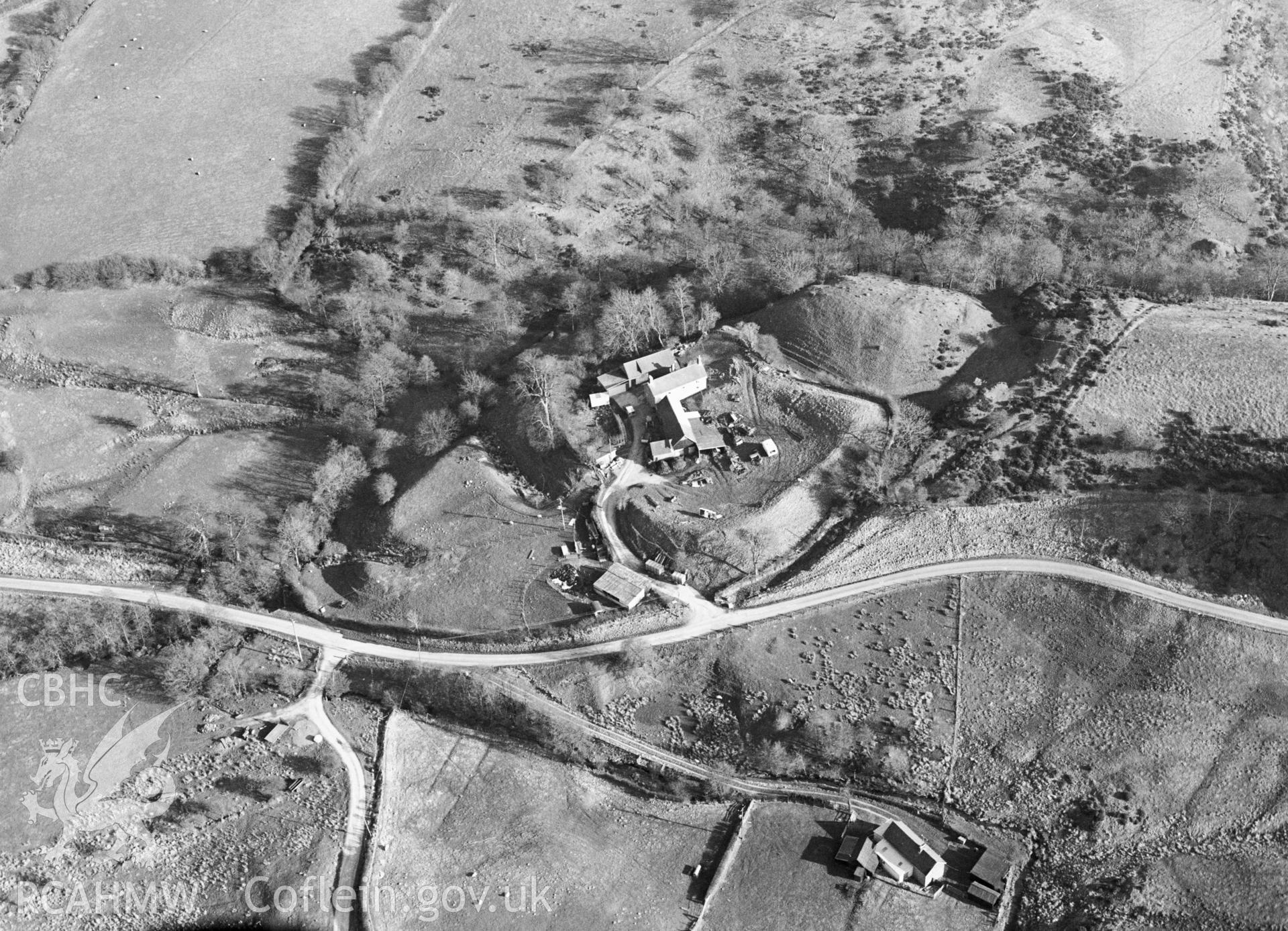 RCAHMW black and white aerial photograph of Warren Bank Motte and Bailey. Taken by C R Musson on 23/03/1995