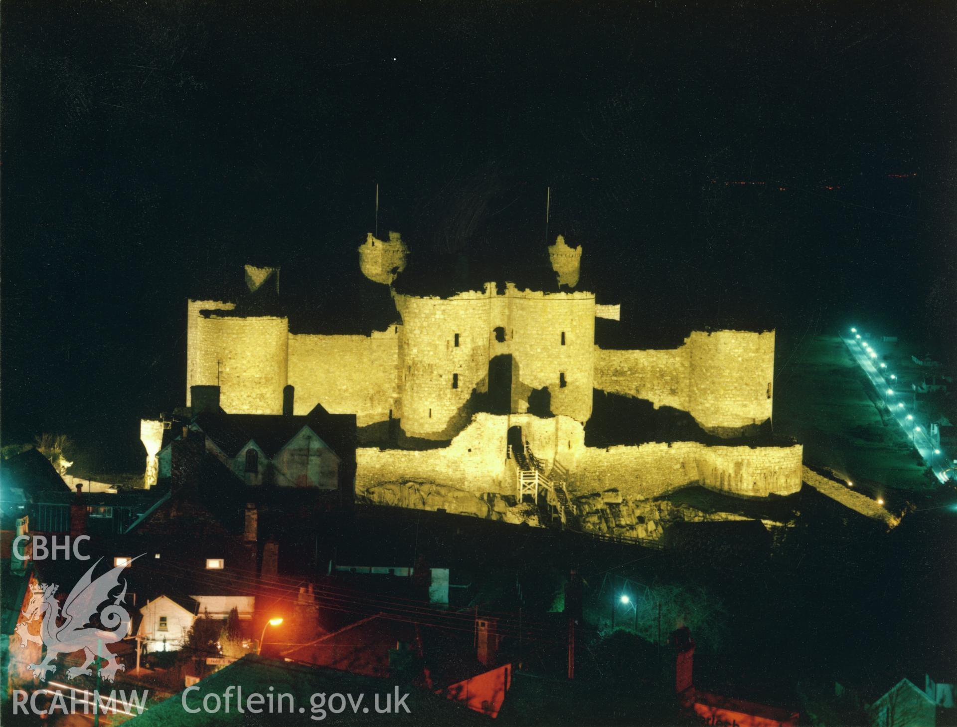 1 of a set of 5 colour prints showing view of Harlech castle at night, collated by the former Central Office of Information.