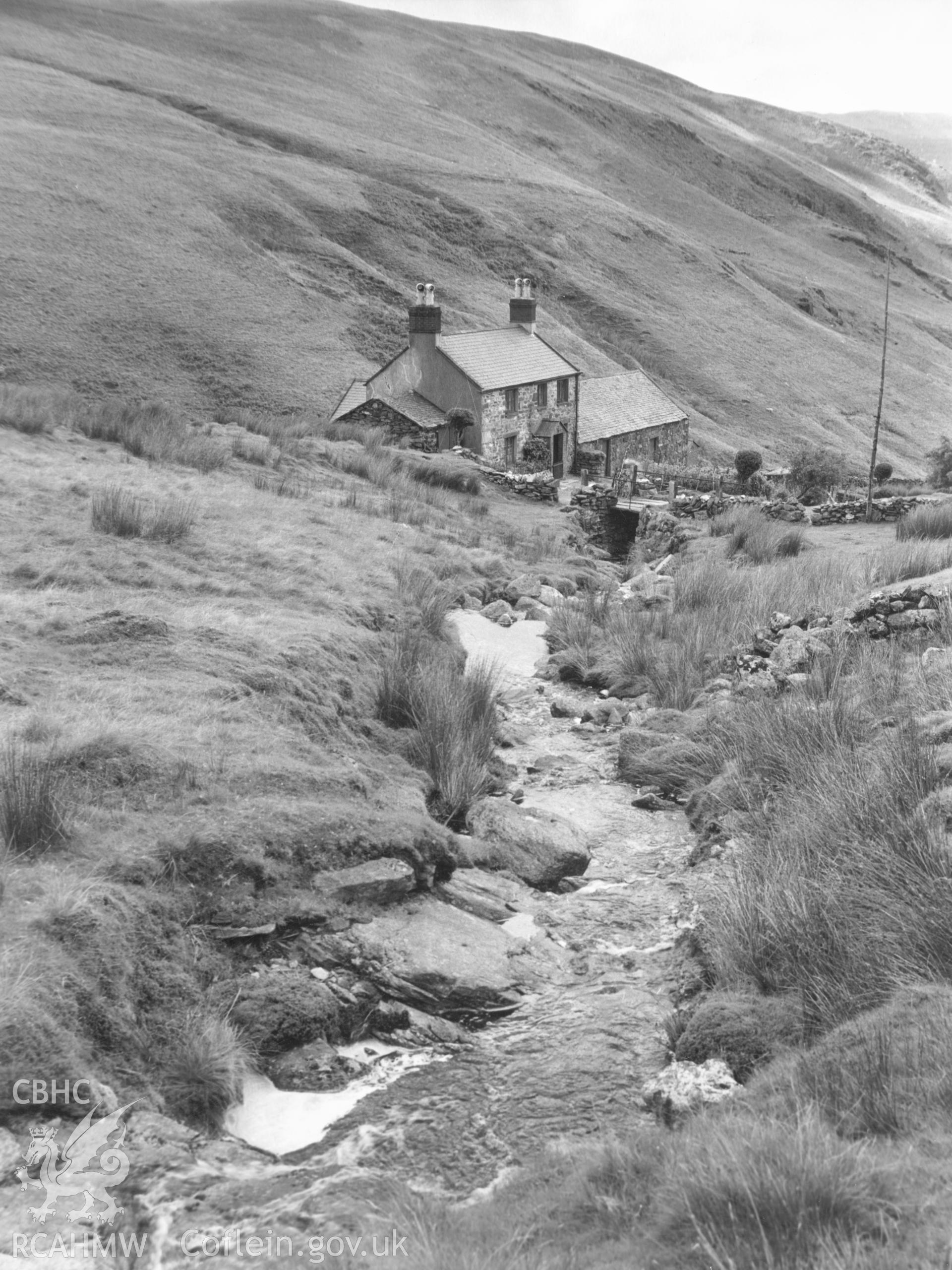 1 b/w print showing view of farmstead on hillside near Blaenau Ffestiniog; collated by the former Central Office of Information.