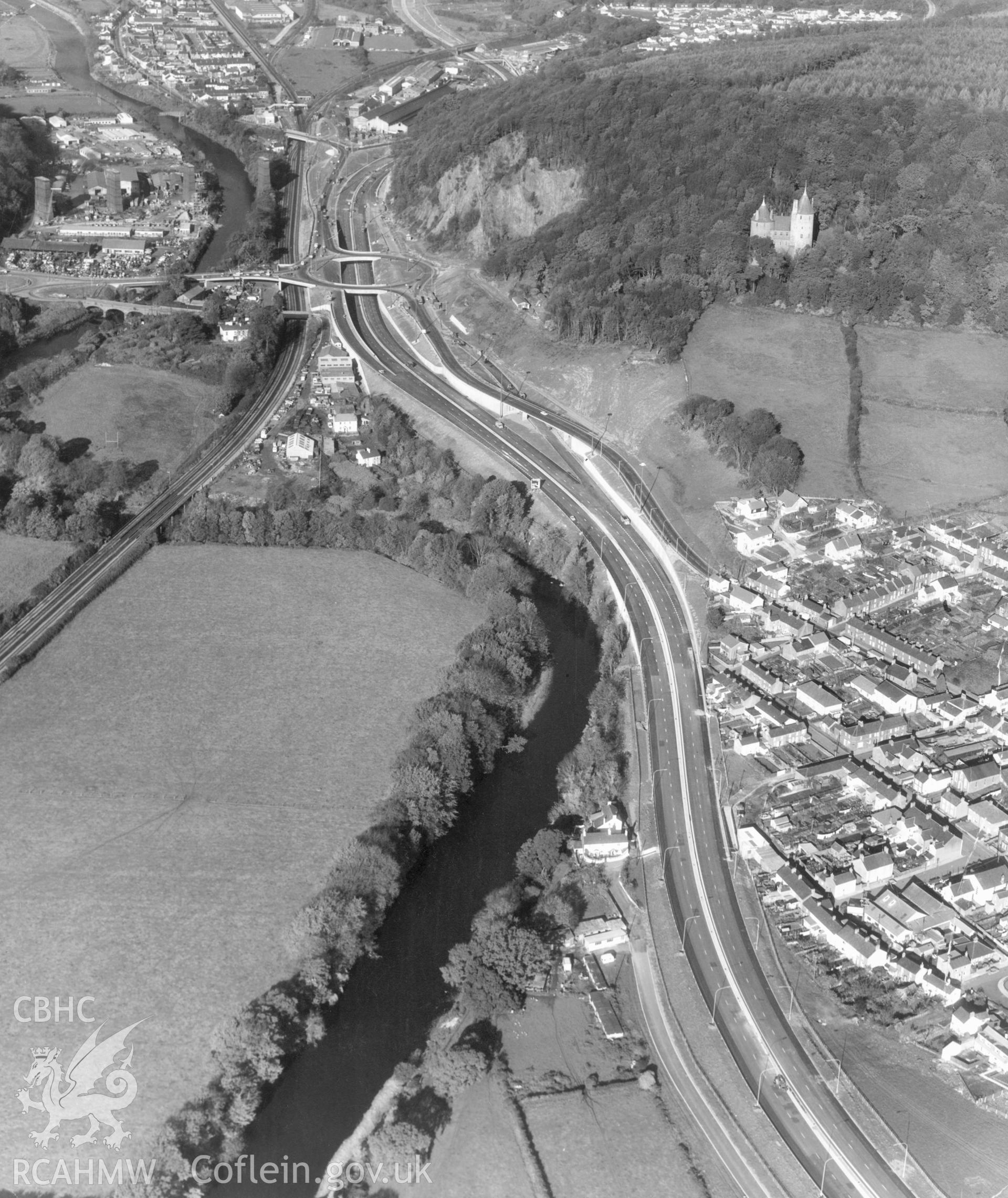 1 b/w print showing part of the newly built Cardiff to Merthyr trunk road and roundabout (now the A470(T))with Tongwynlais, Castell Coch and the river Taff; collated by the former Central Office of Information.