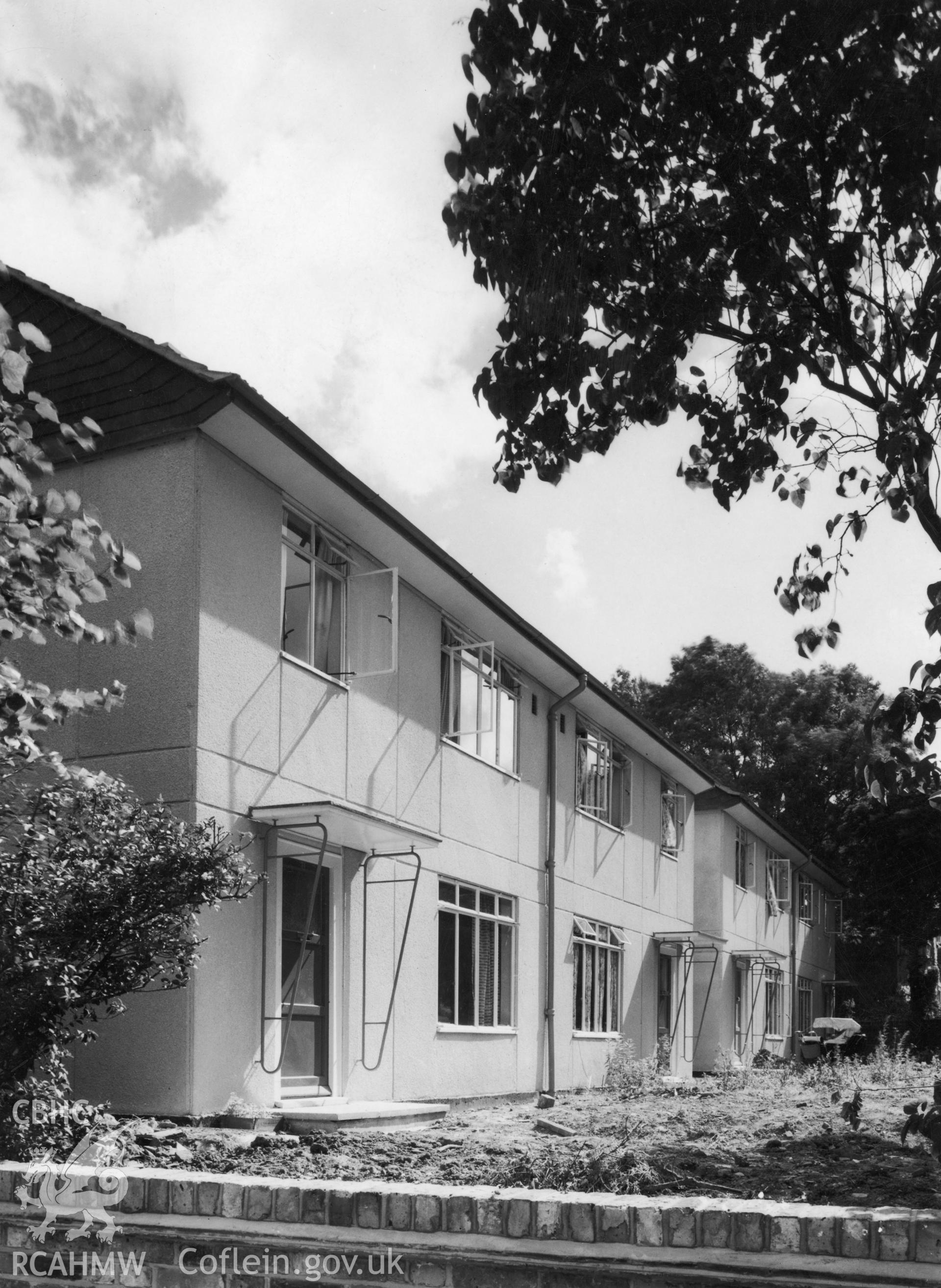 1 b/w print showing 2-storey prefabricated Wates houses in Wales, dated c. 1951; collated by the former Central Office of Information.
