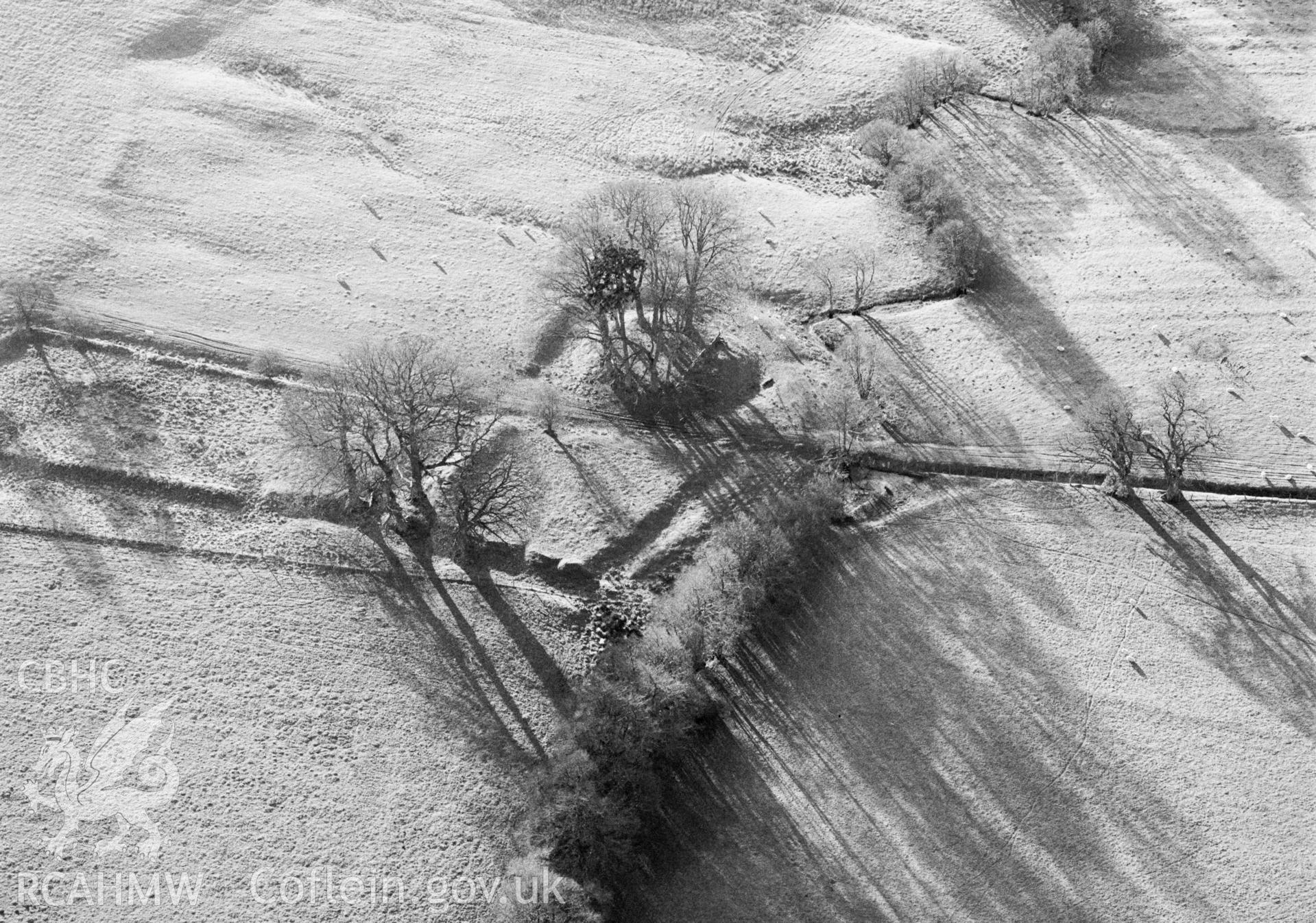 RCAHMW black and white oblique aerial photograph of Castle Nimble, taken by C R Musson, 27/12/1996.