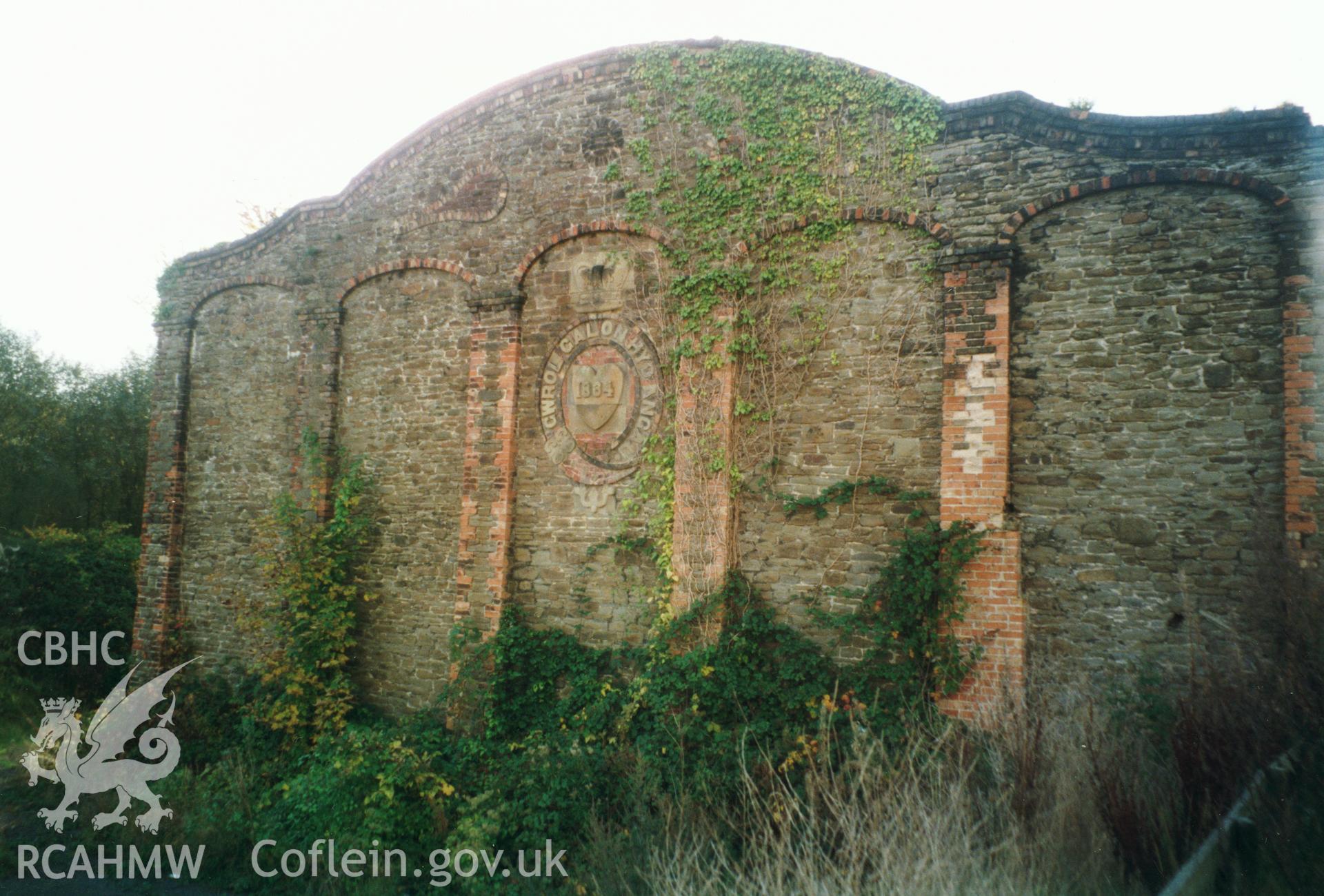 Colour photograph showing Handball Court at Jersey Marine, Coedffranc, Glamorgan (view of end wall with plaque); taken during Cadw listed building resurvey programme, organised alphabetically by Old County and Community.