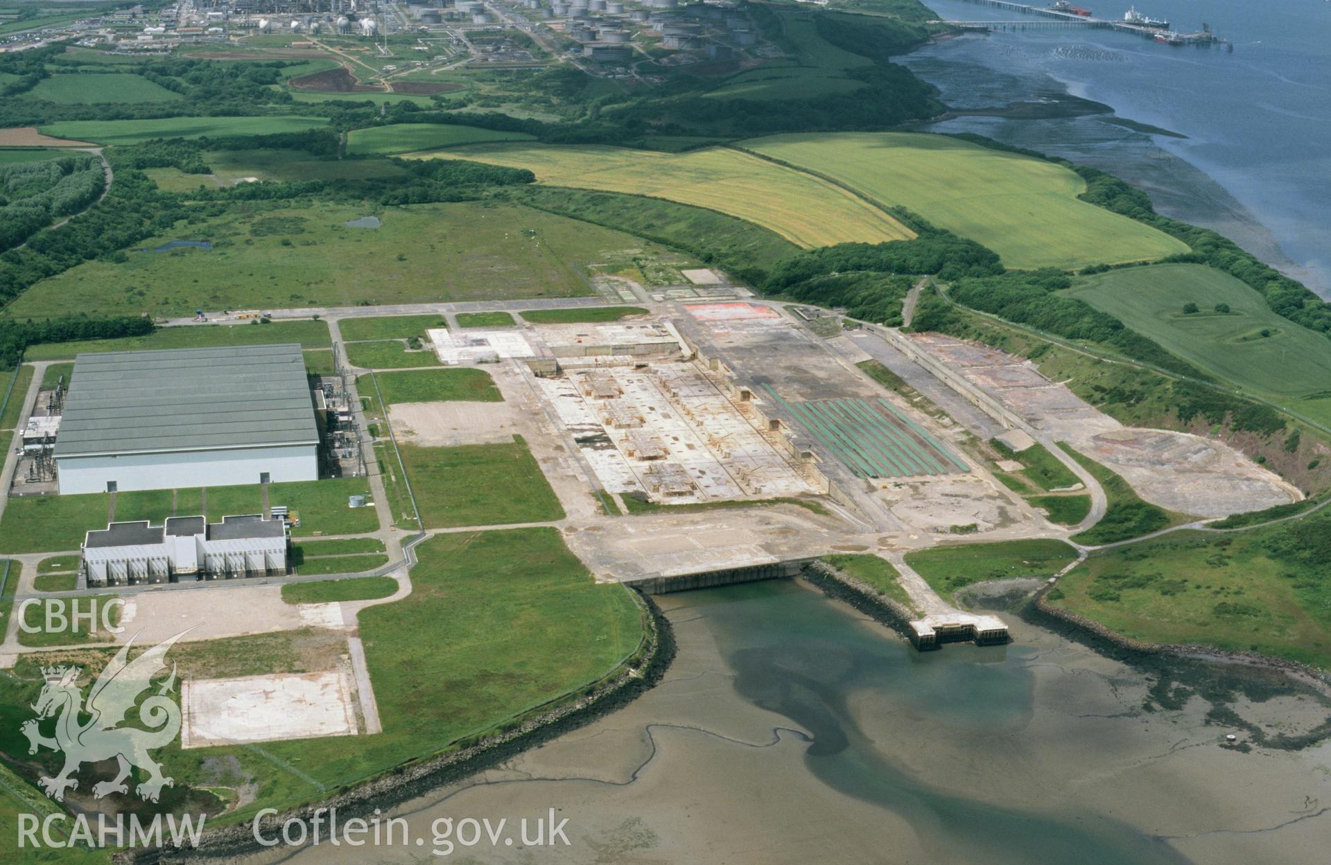 RCAHMW colour oblique aerial photograph of Pembroke Power Station, reduced to foundations. Taken by Toby Driver on 13/06/2003