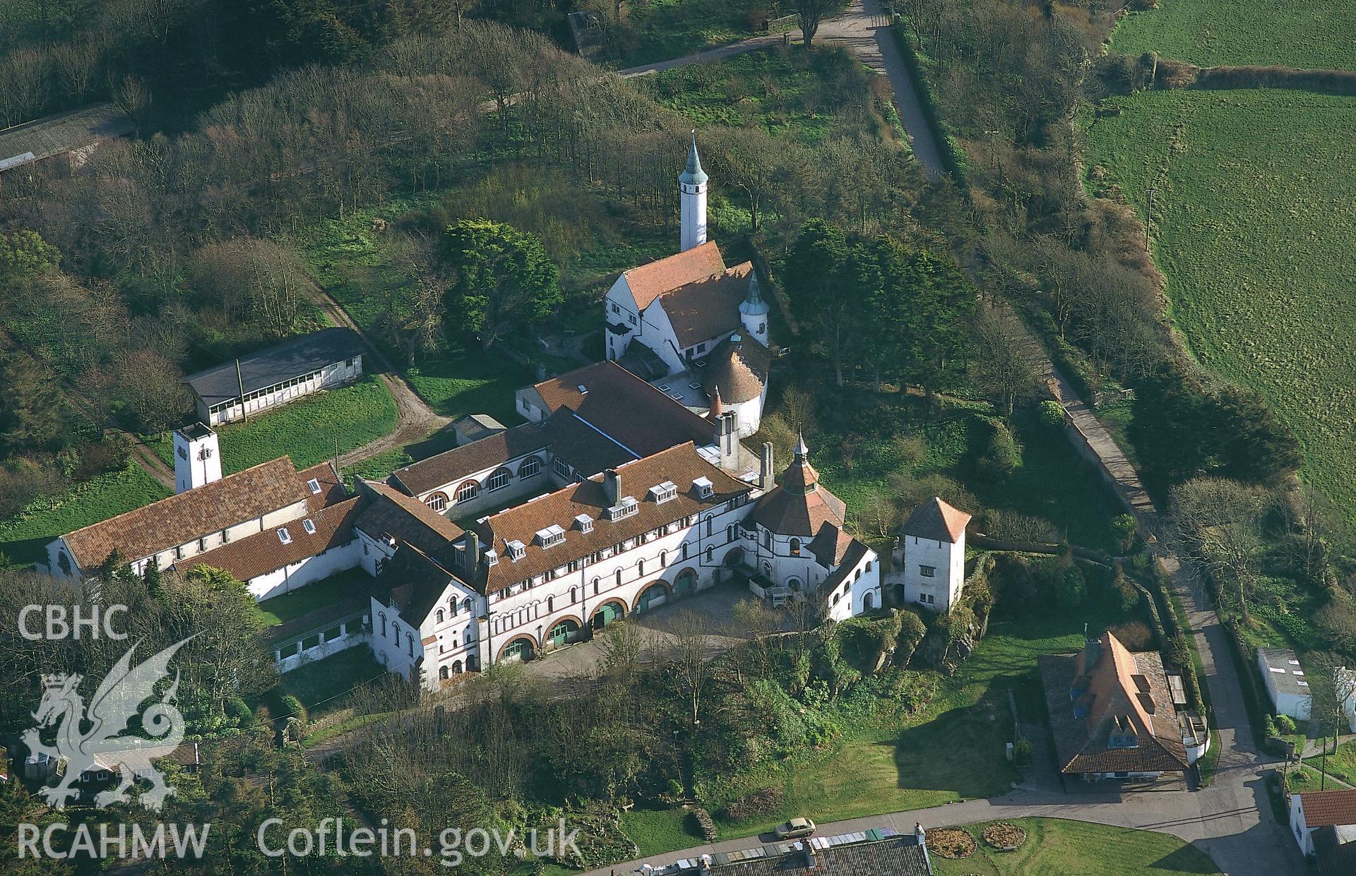 RCAHMW colour oblique aerial photograph of Caldey Island monastery. Taken by C R Musson on 13/04/1995