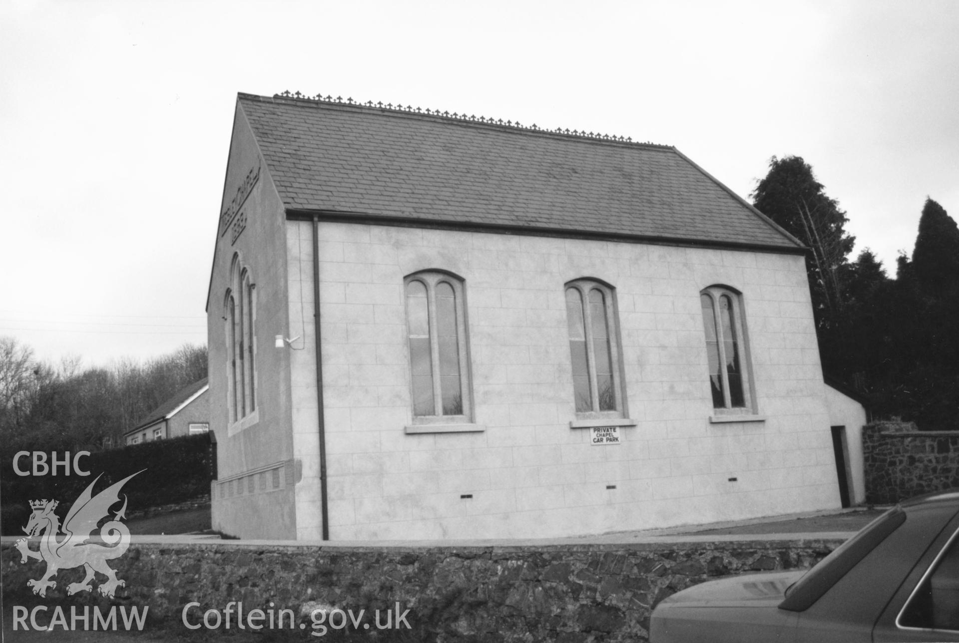 Digital copy of a black and white photograph showing an exterior view of Stepaside Wesleyan Methodist Chapel, taken by Robert Scourfield, 1996.