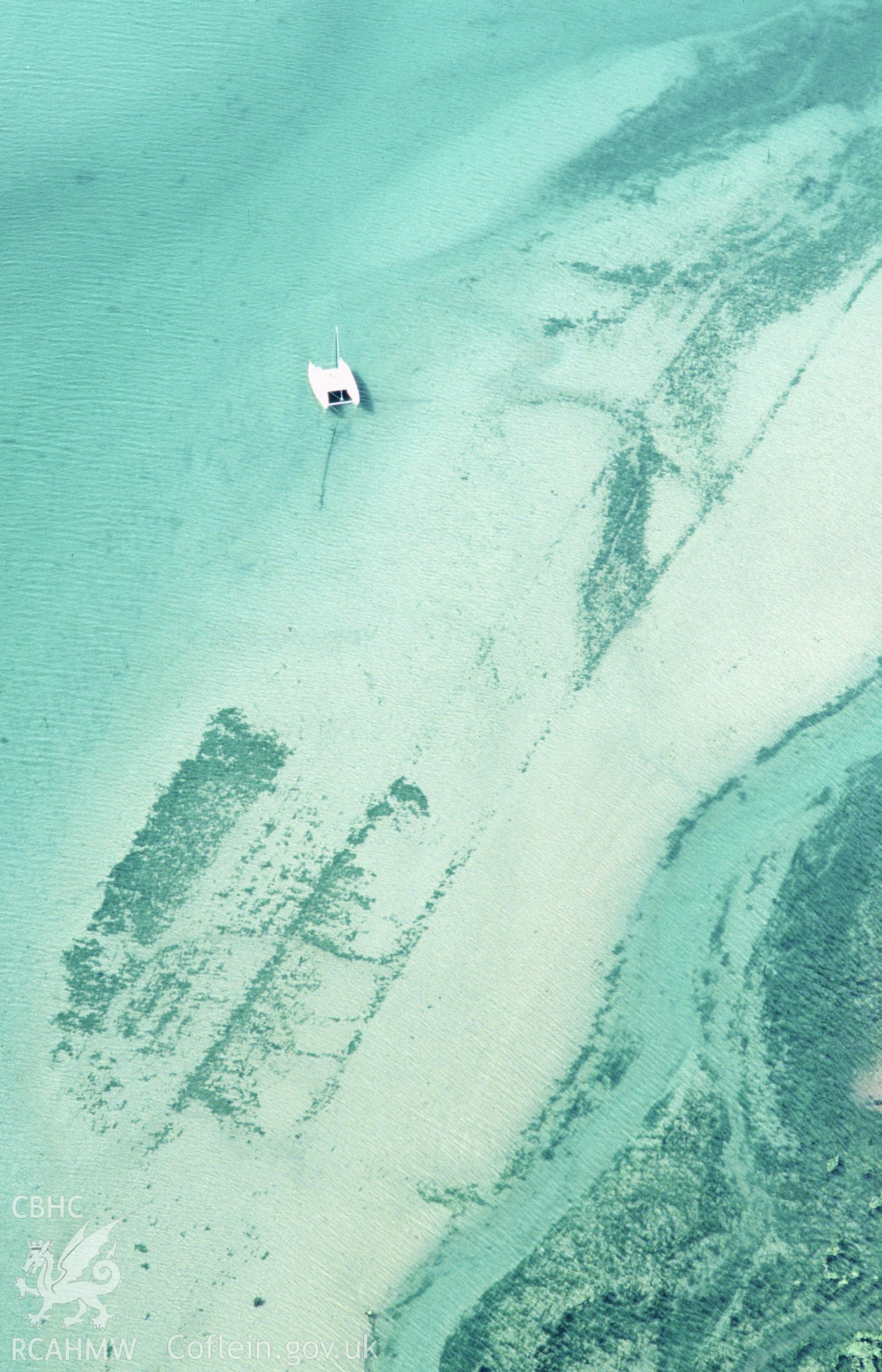 RCAHMW colour oblique aerial photograph of Sandy Haven Pill, submerged structures, jetty?. Taken by Toby Driver on 28/06/2002
