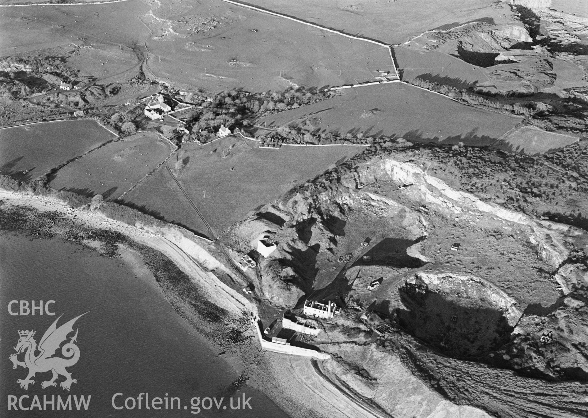 RCAHMW Black and white oblique aerial photograph of Penmon Priory, taken on 10/01/1999 by Toby Driver
