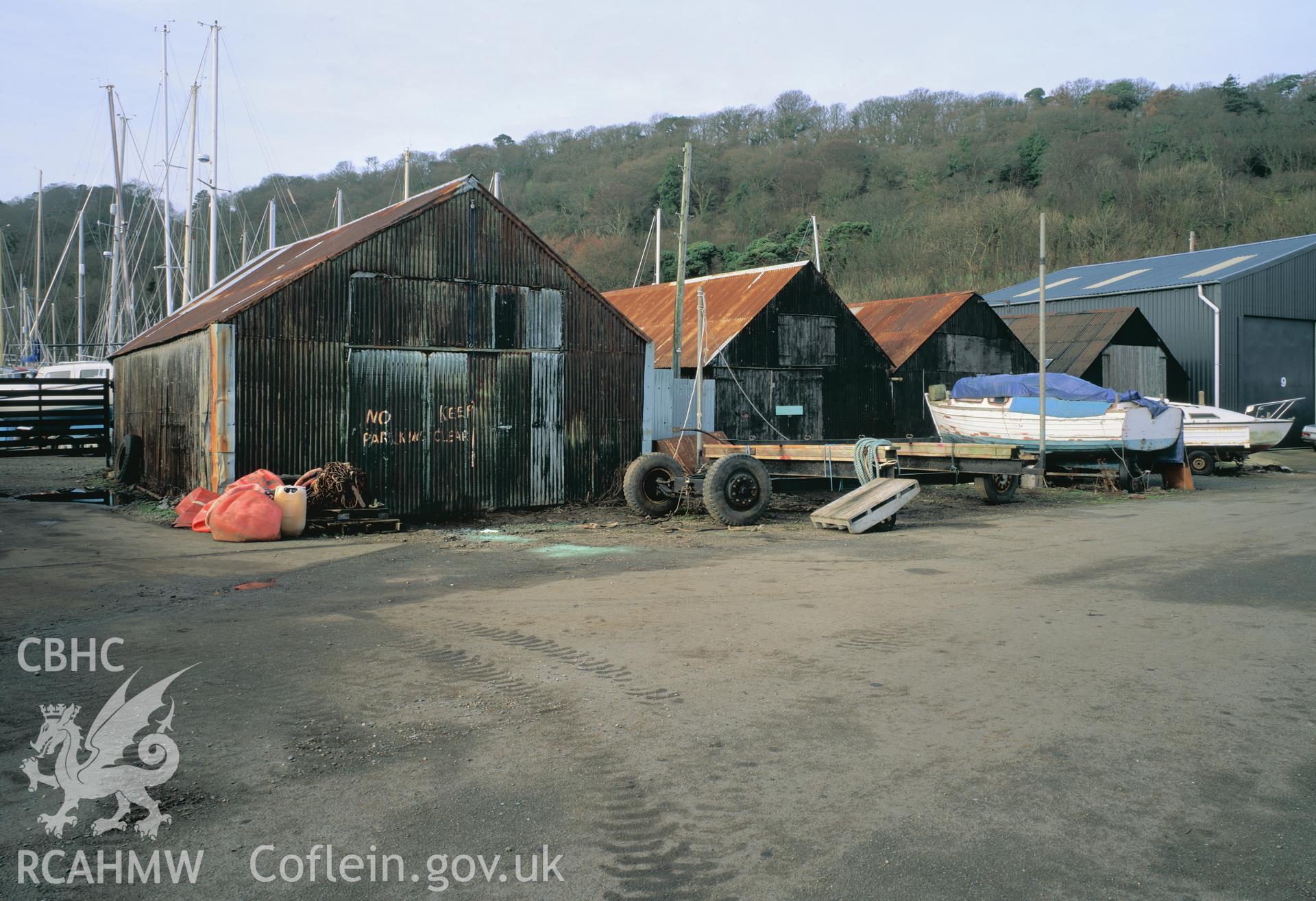 RCAHMW colour transparency showing fishermens sheds at Gallows Point, Anglesy.