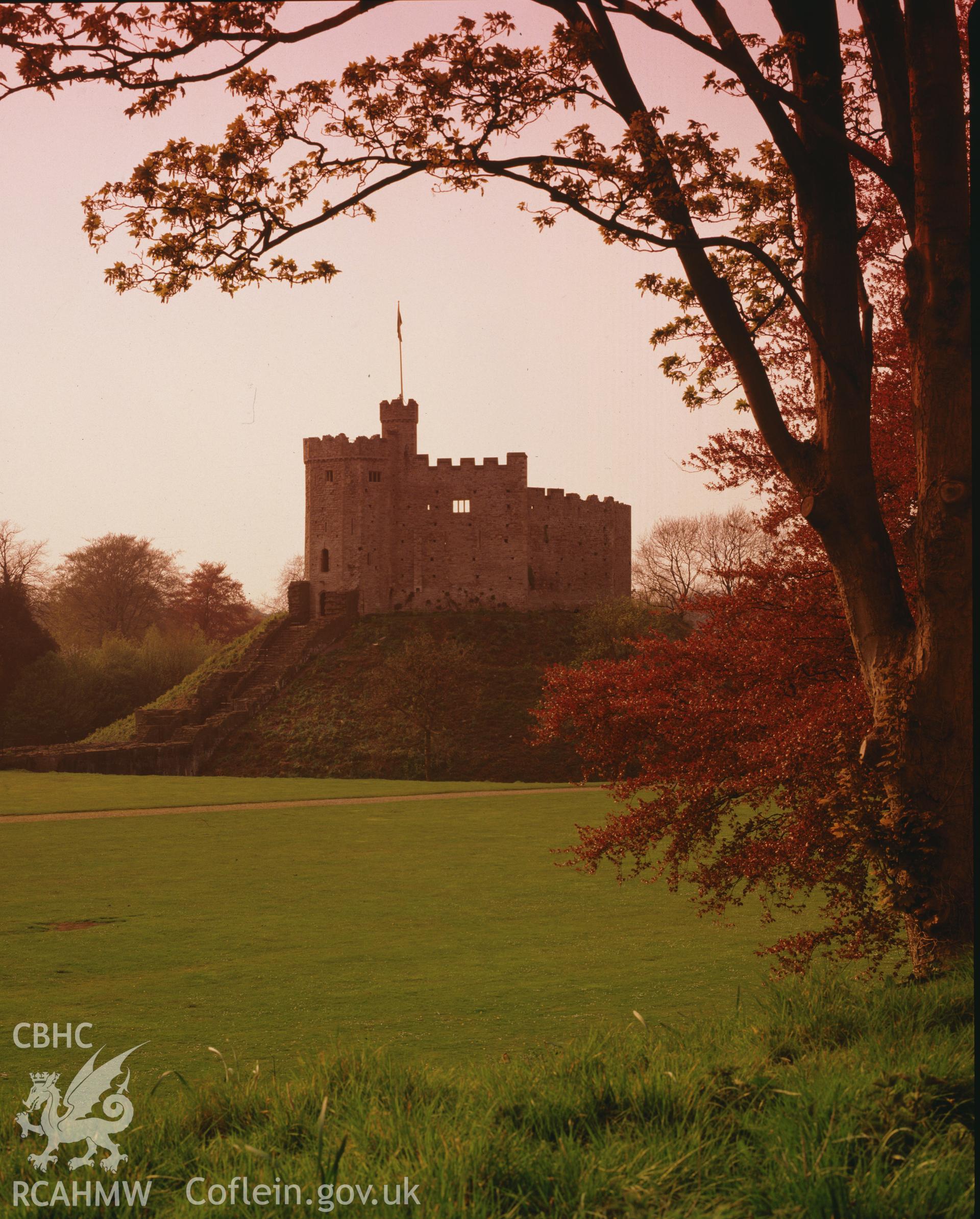 RCAHMW colour transparency of a general view of Cardiff Castle at sunset.