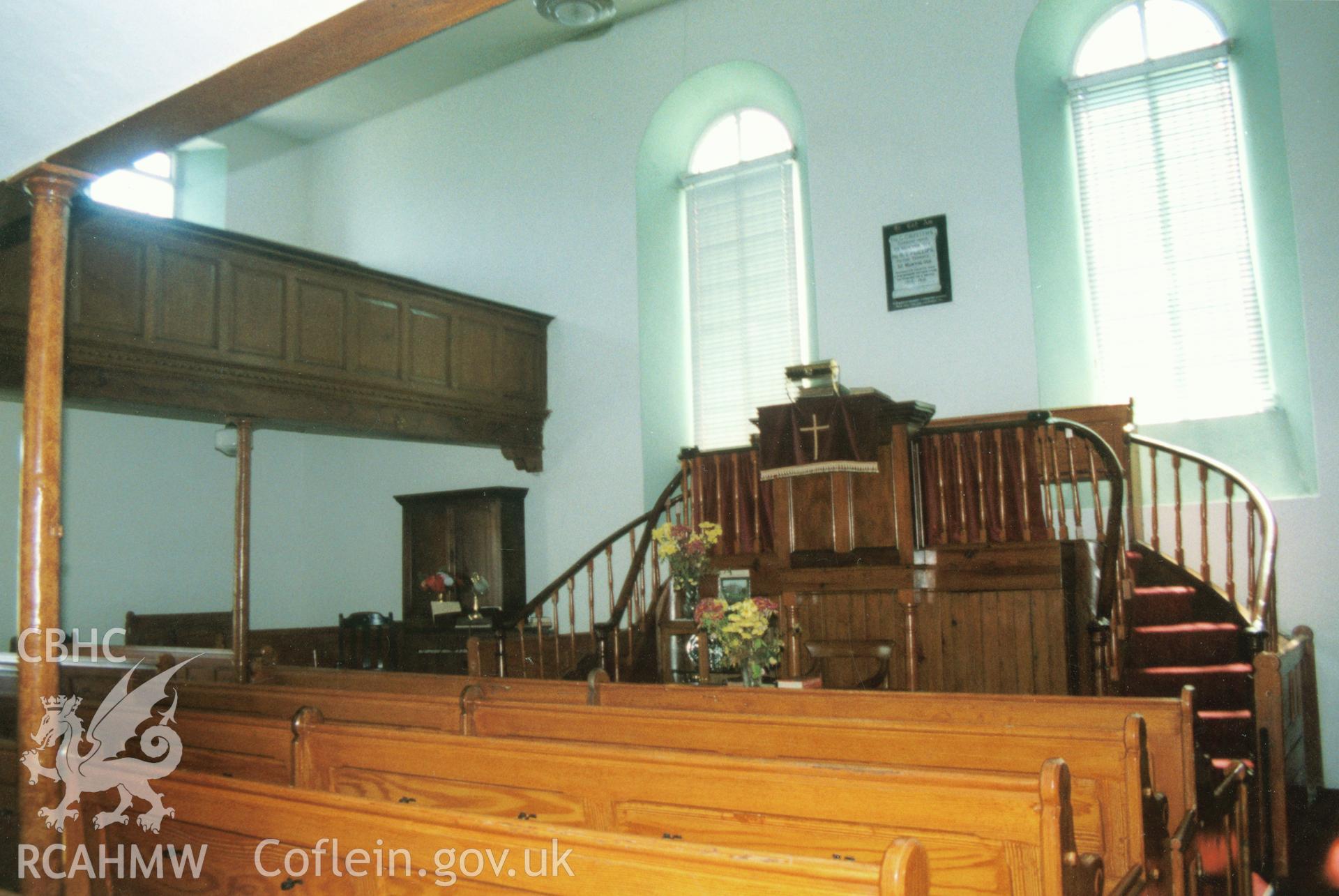 Digital copy of a colour photograph showing an interior view of Ffynnon Welsh Baptist Chapel, Llanddewi Velfrey, taken by Robert Scourfield, 1996.