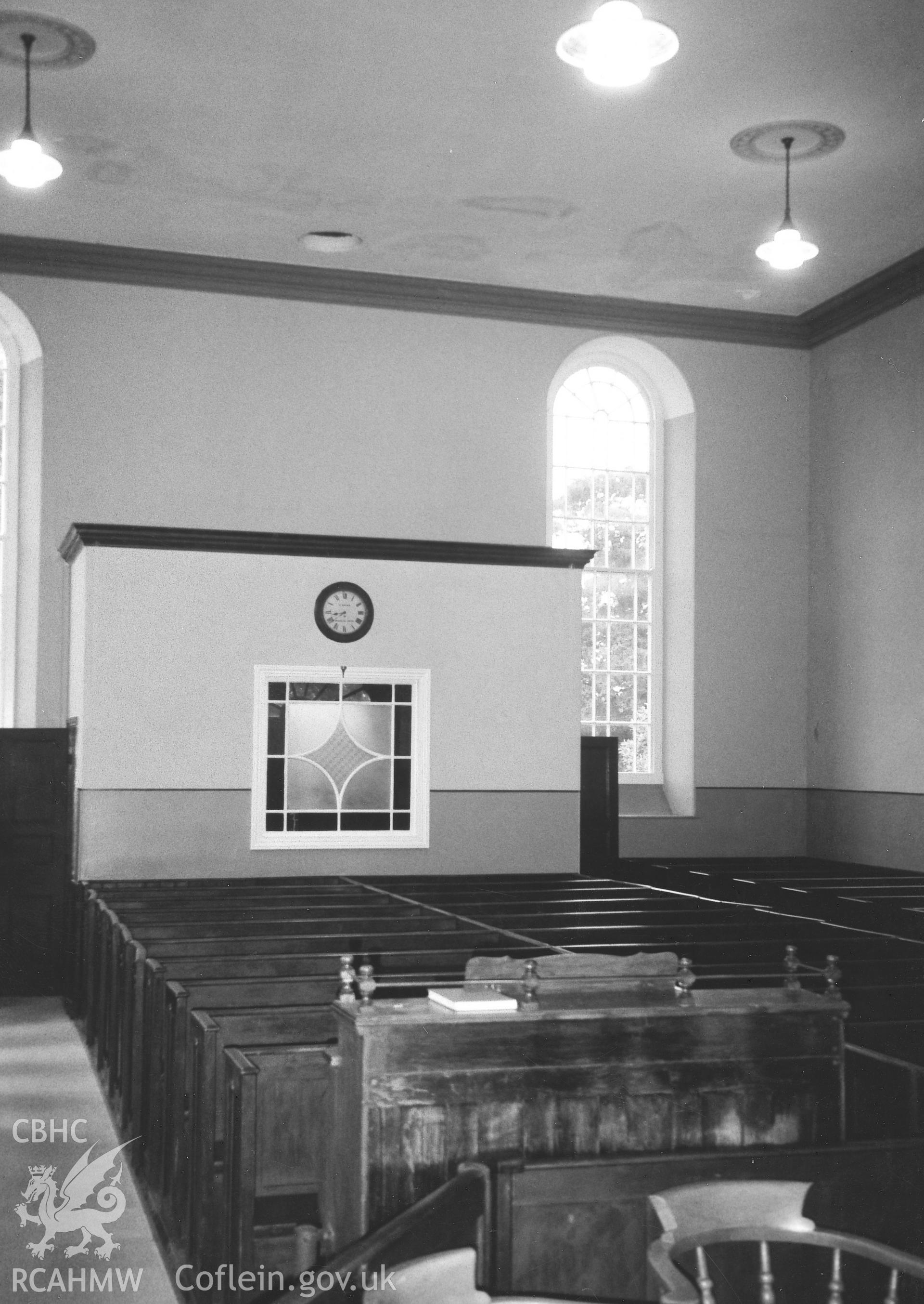 Digital copy of a black and white photograph showing an interior view of Capel Drindod Independent Chapel, Aberbanc, taken by Robert Scourfield, 1995.