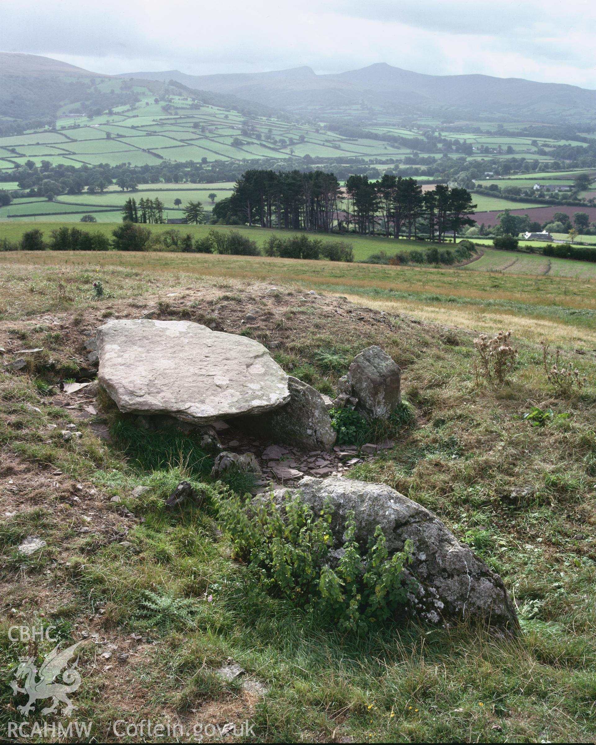 Colour transparency showing a view of Ty Illtud chambered tomb, produced by Iain Wright, c.1981
