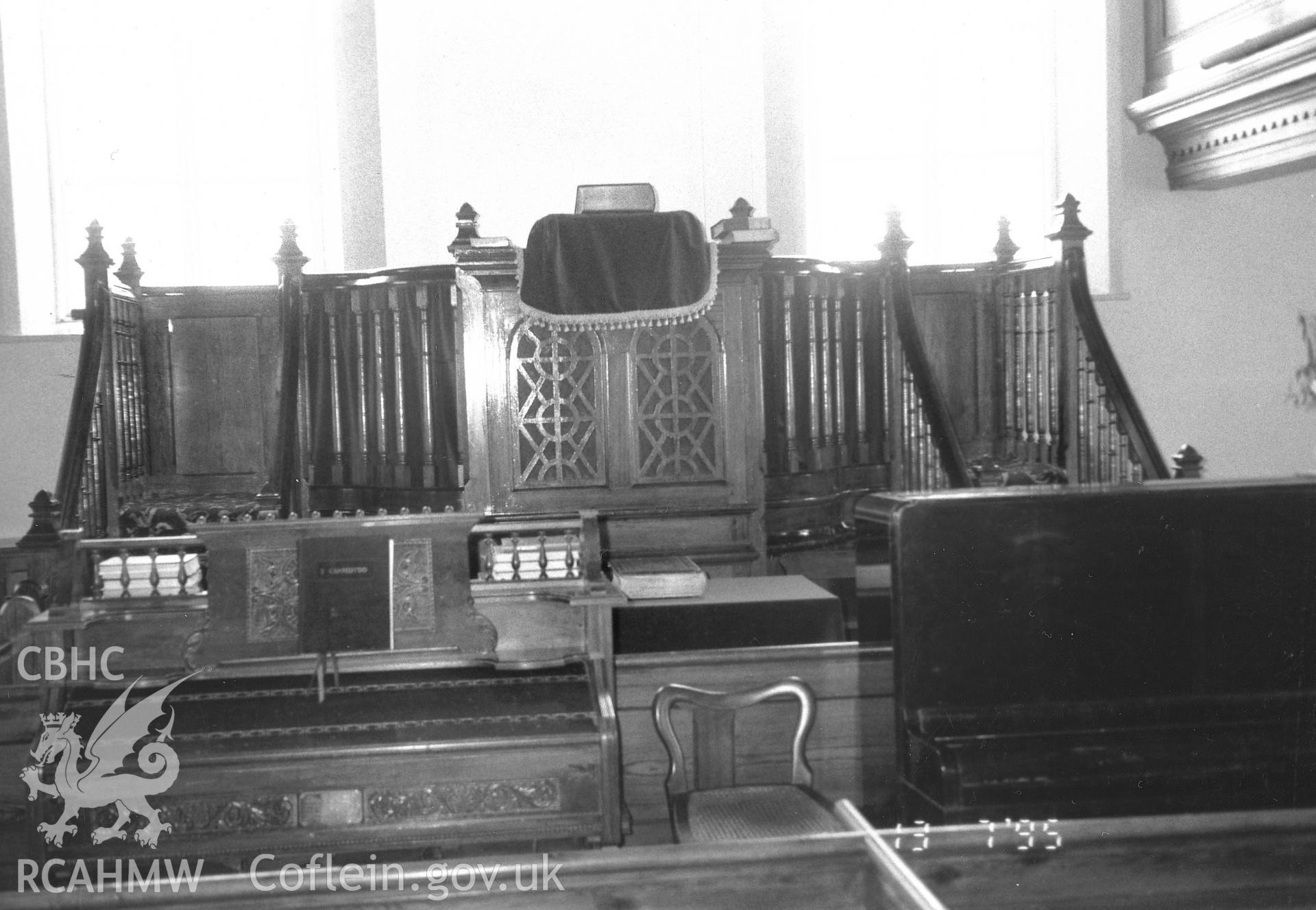 Digital copy of a black and white photograph showing an interior view of Bryngwenith Independent Chapel, Llandyfriog, taken by Robert Scourfield, 1995.
