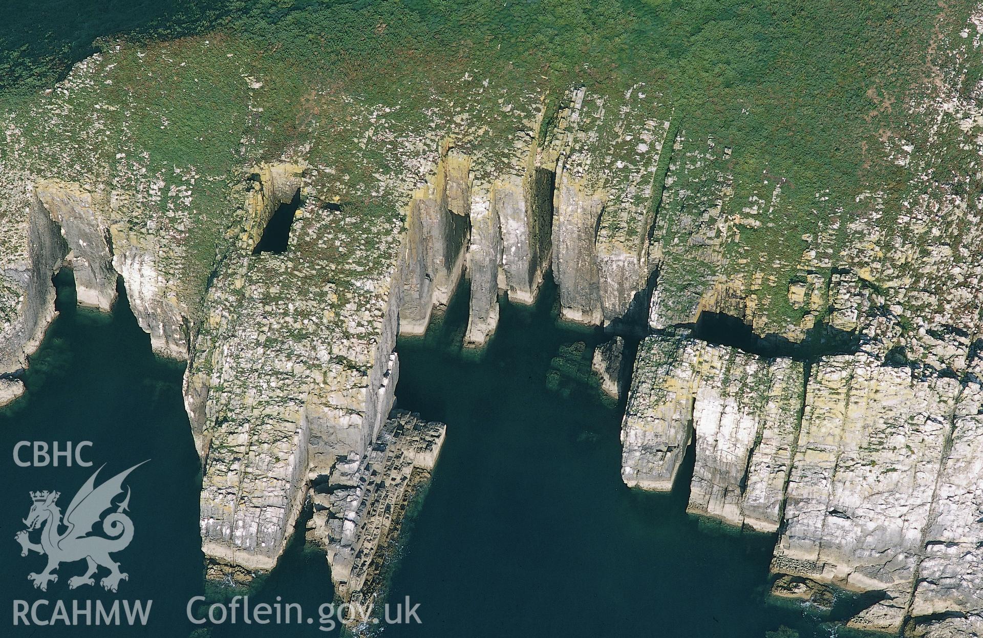 RCAHMW colour oblique aerial photograph of west cliffs of St Margaret's Island, taken by Toby Driver on 02/09/2002