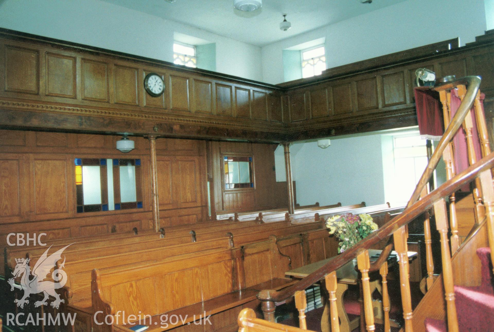 Digital copy of a colour photograph showing an interior view of Ffynnon Welsh Baptist Chapel, Llanddewi Velfrey, taken by Robert Scourfield, 1996.