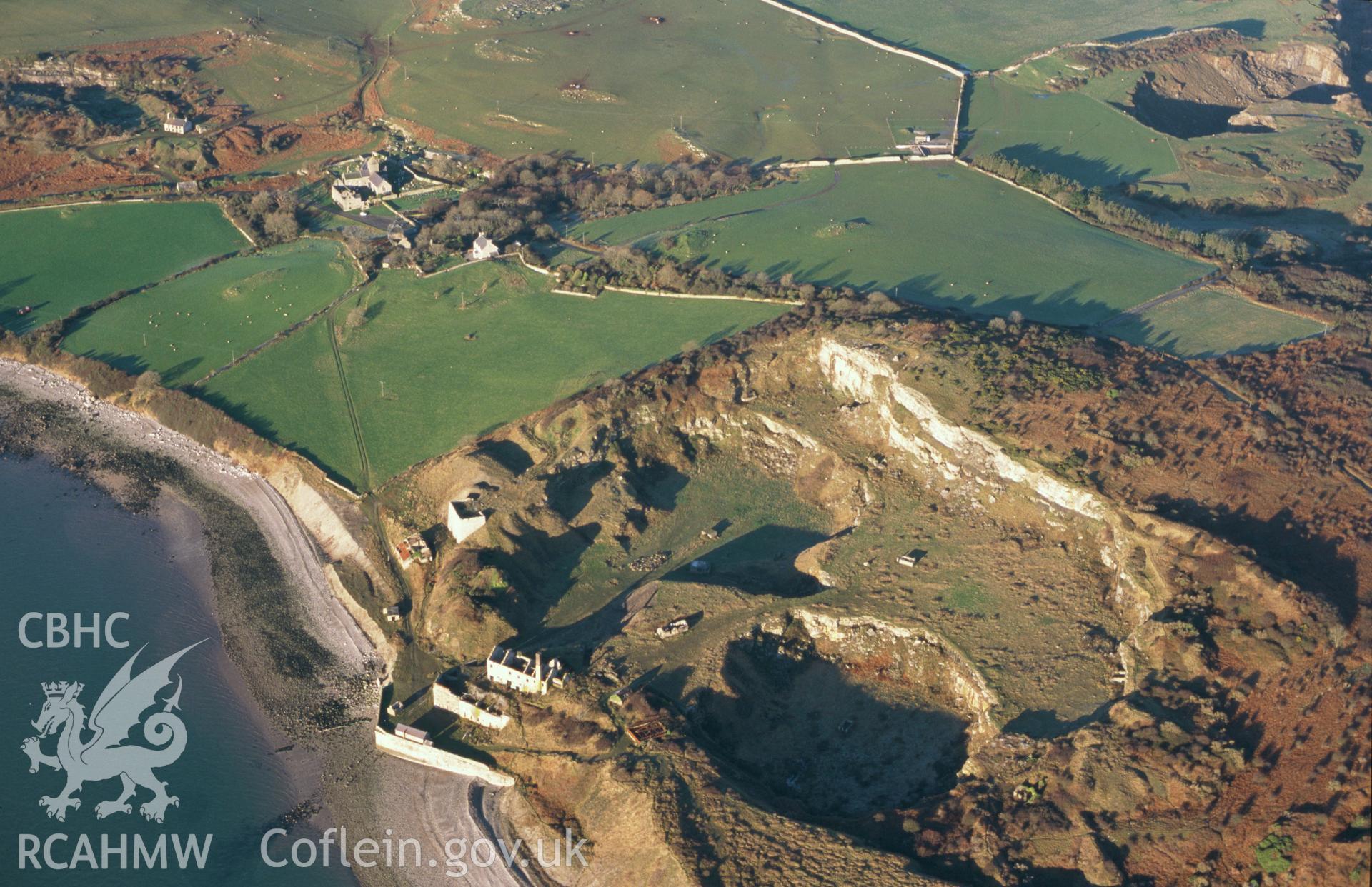 RCAHMW colour slide oblique aerial photograph of Penmon Priory, taken on 10/01/1999 by Toby Driver