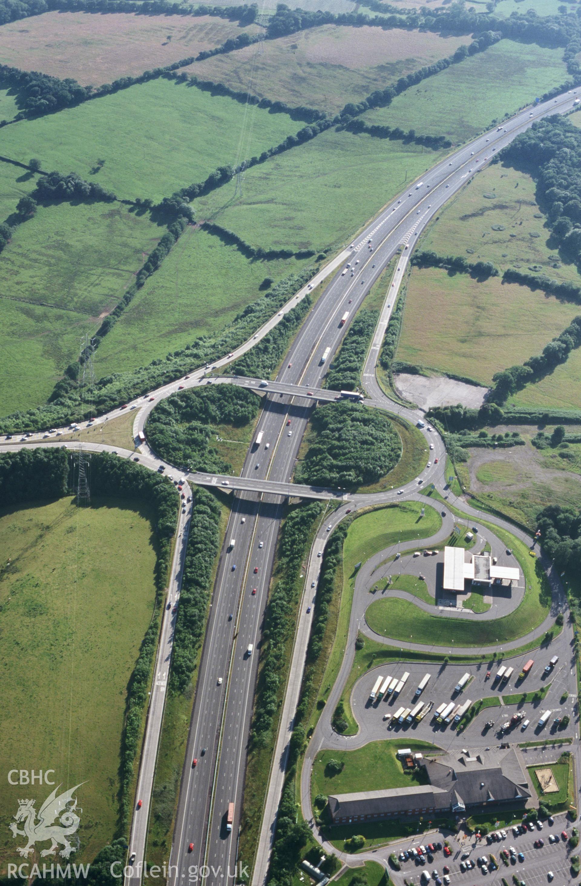 RCAHMW colour slide oblique aerial photograph of M4 Cardiff West Junction, Pentyrch, taken by T.G.Driver on the 18/07/2000