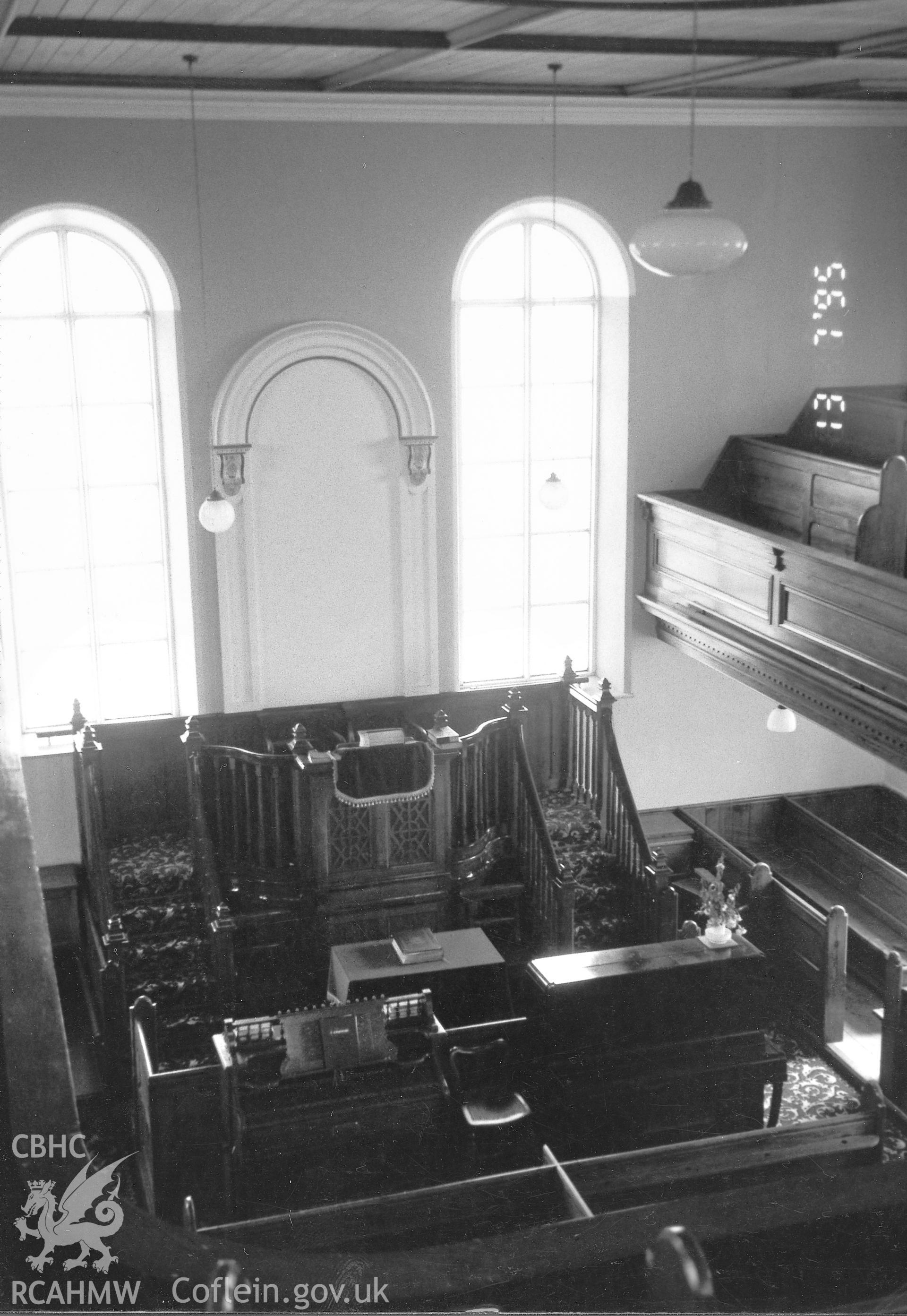 Digital copy of a black and white photograph showing an interior view of Bryngwenith Independent Chapel, Llandyfriog, taken by Robert Scourfield, 1995.